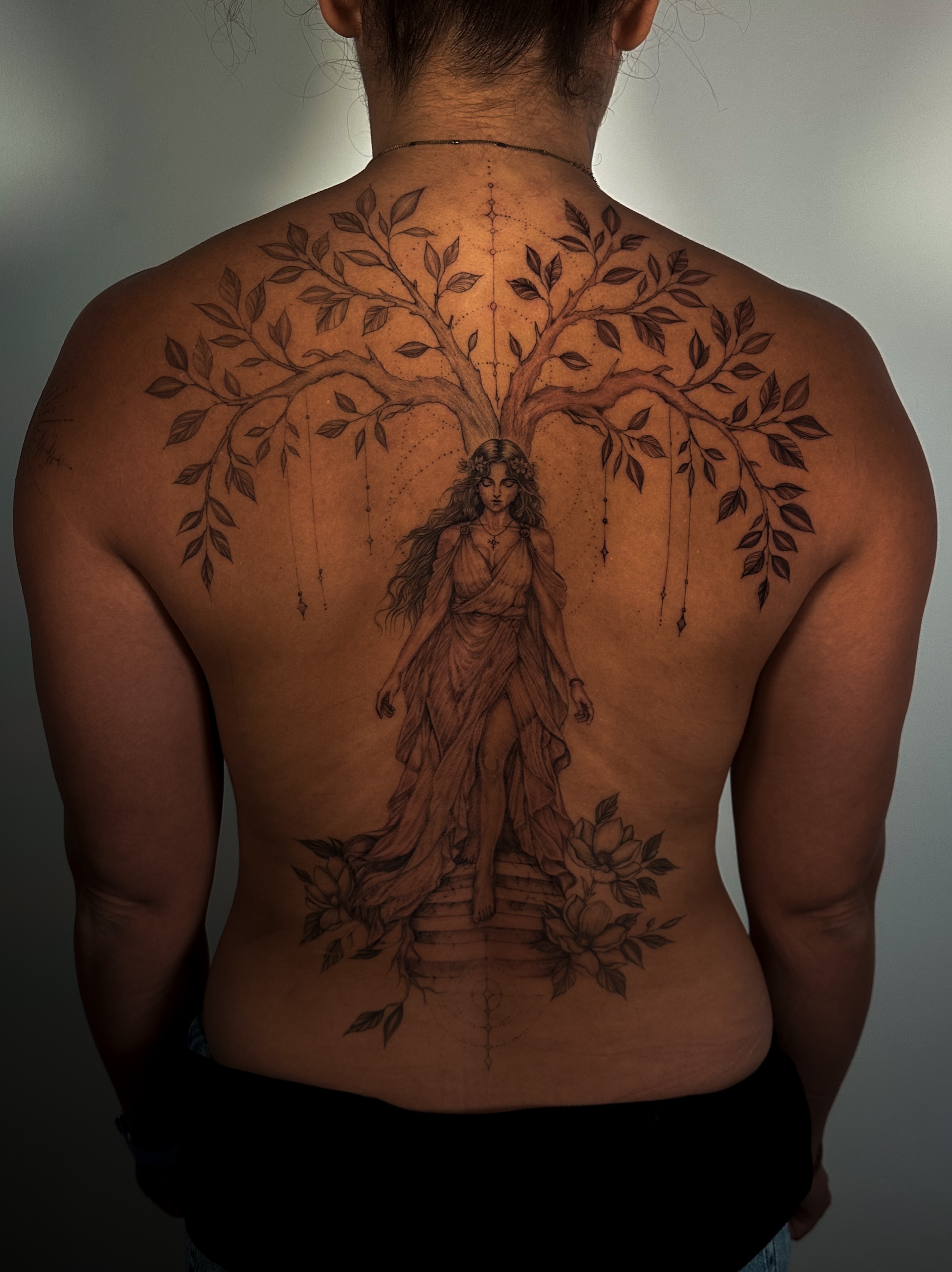 Tree of life with woman realism tattoo on the back by Caroline + Utah Tattoo Artist