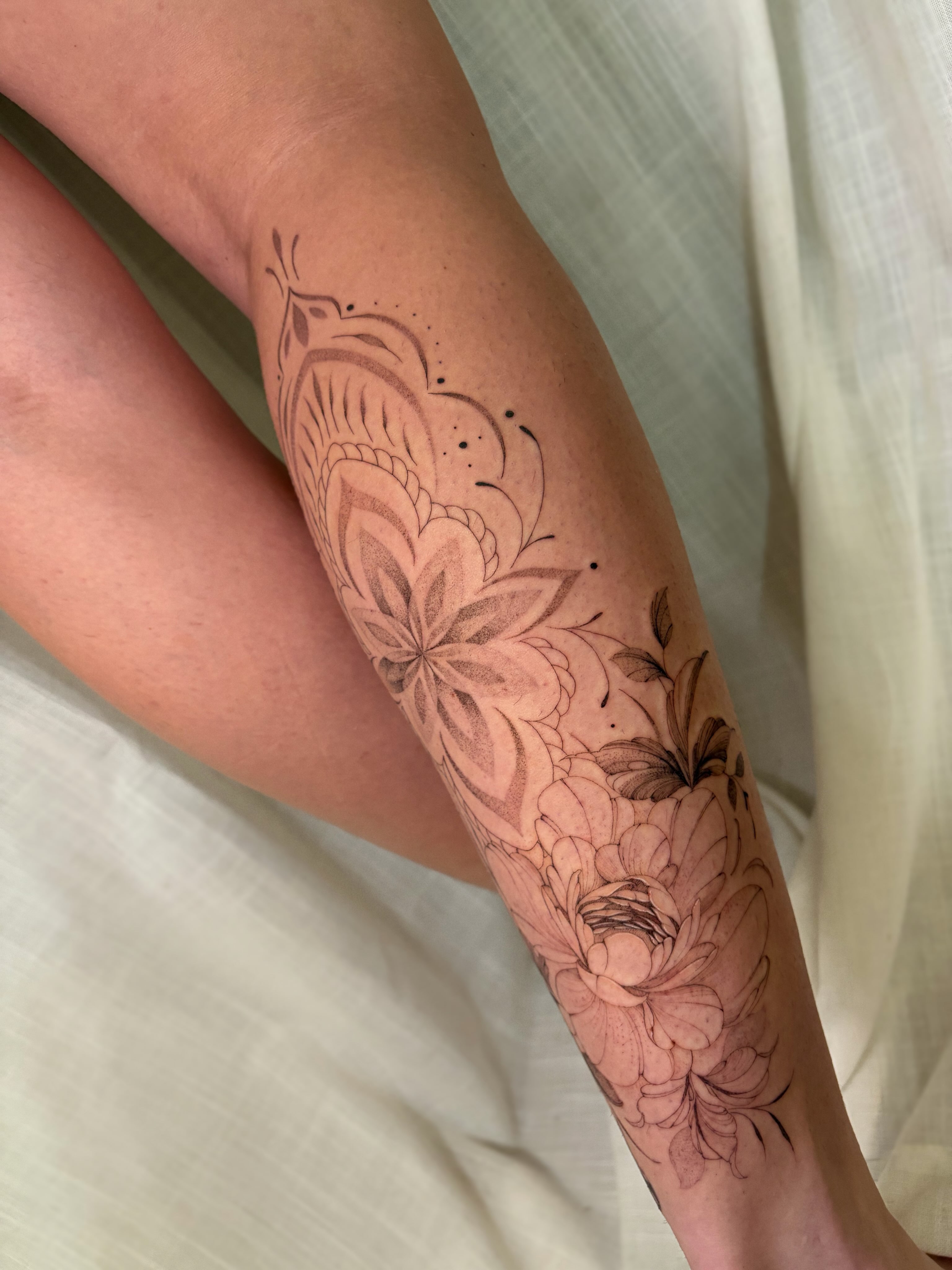 Floral design black and grey tattoo on the forearm by Justene Renee 🖤 Fine Line Tattoo Artist
