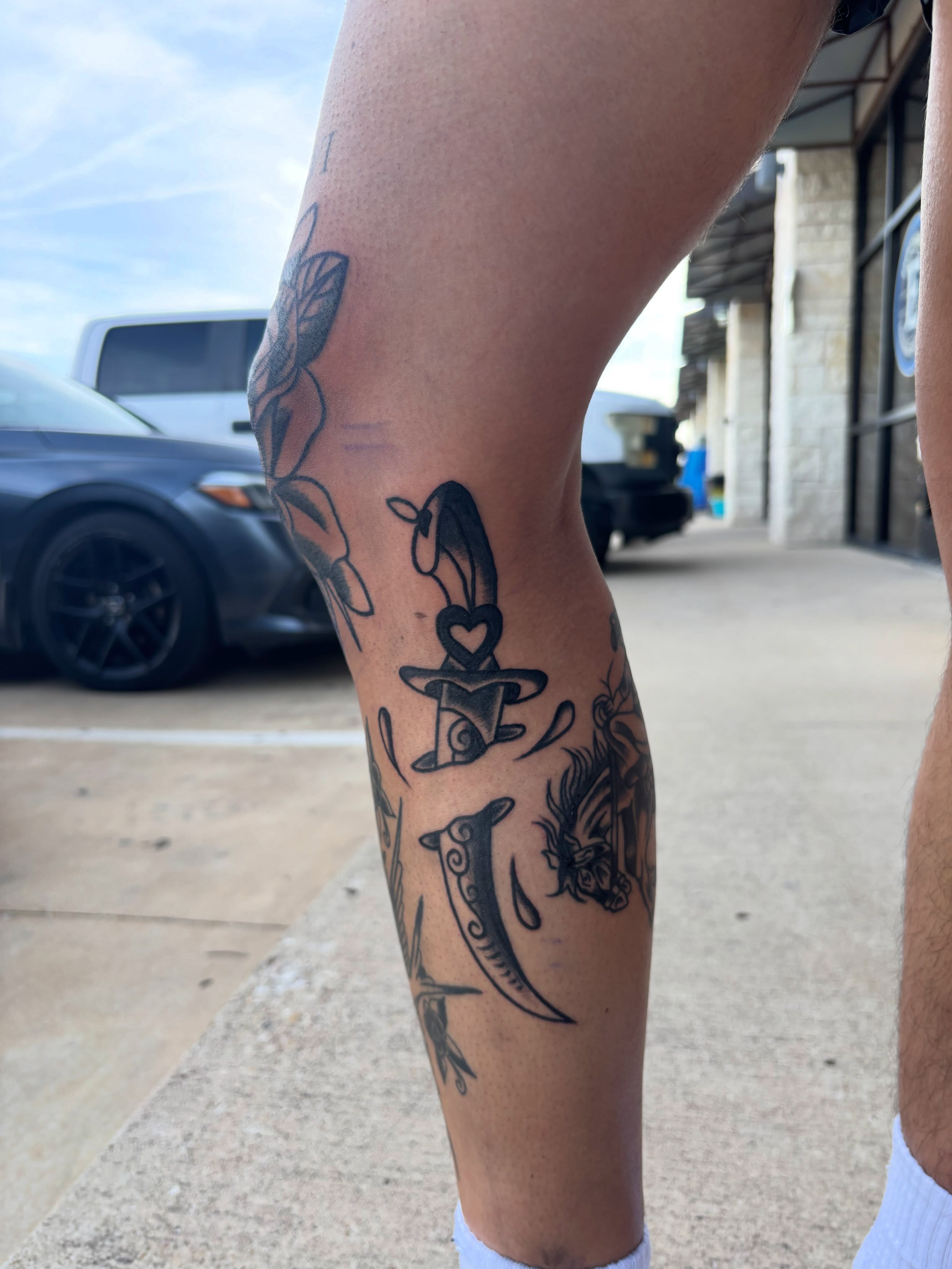 Knife and heart black and grey tattoo on the forearm by Ethan Ellis, Dallas, Texas