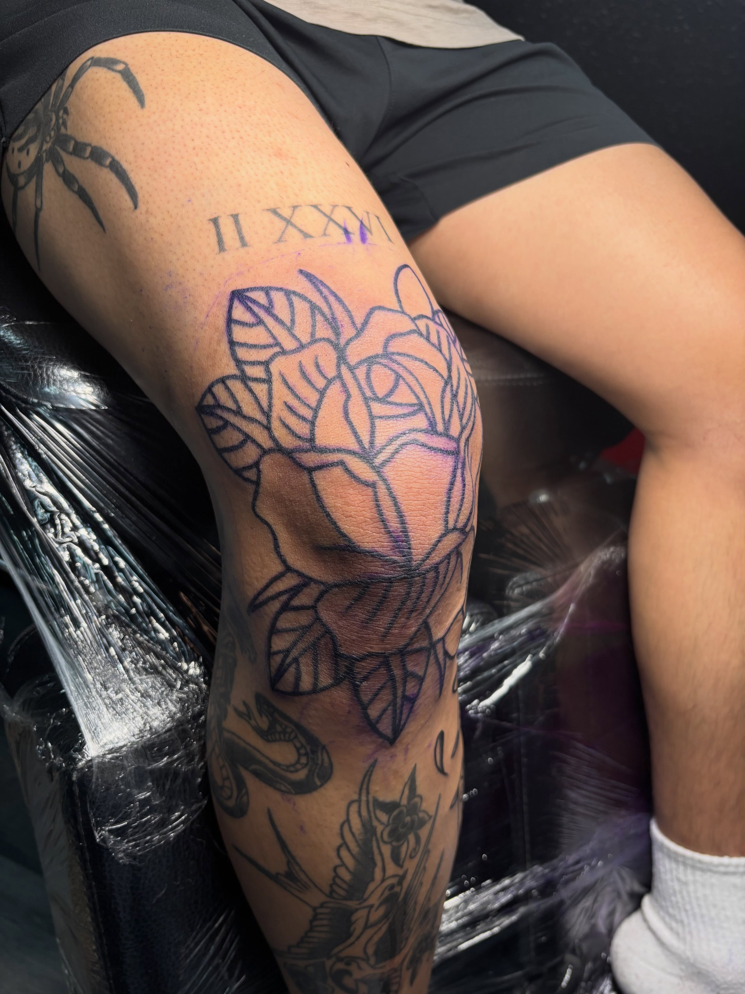 Rose American traditional tattoo on the thigh by Ethan Ellis, Dallas, Texas