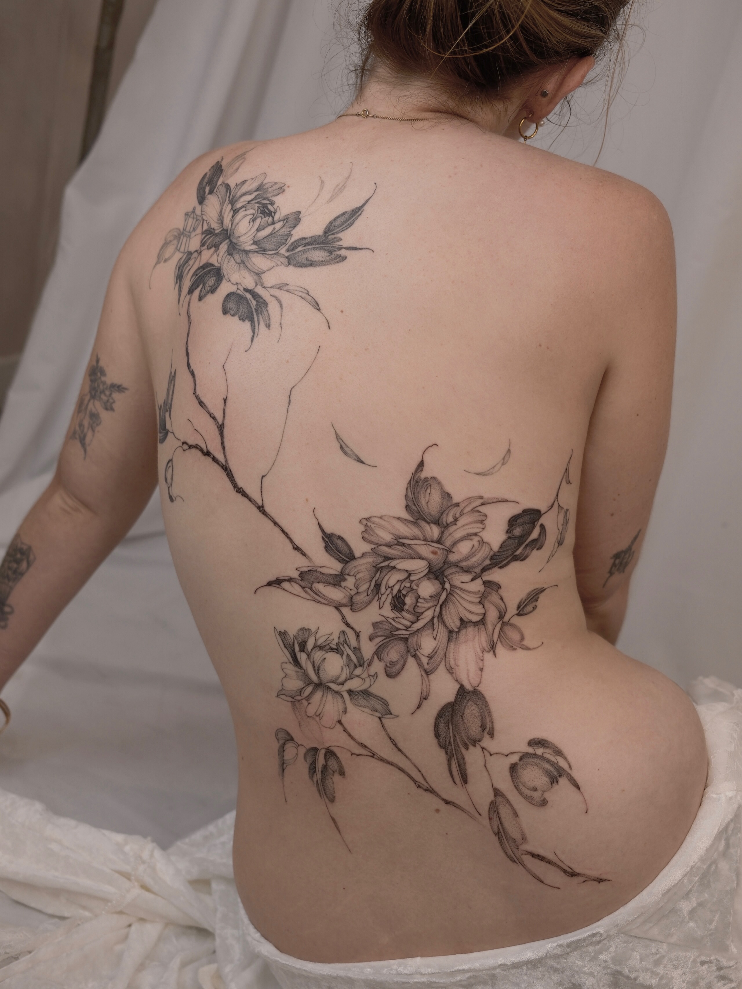Flower bouquet realism tattoo on the back by Joy, Gold Coast, Queensland