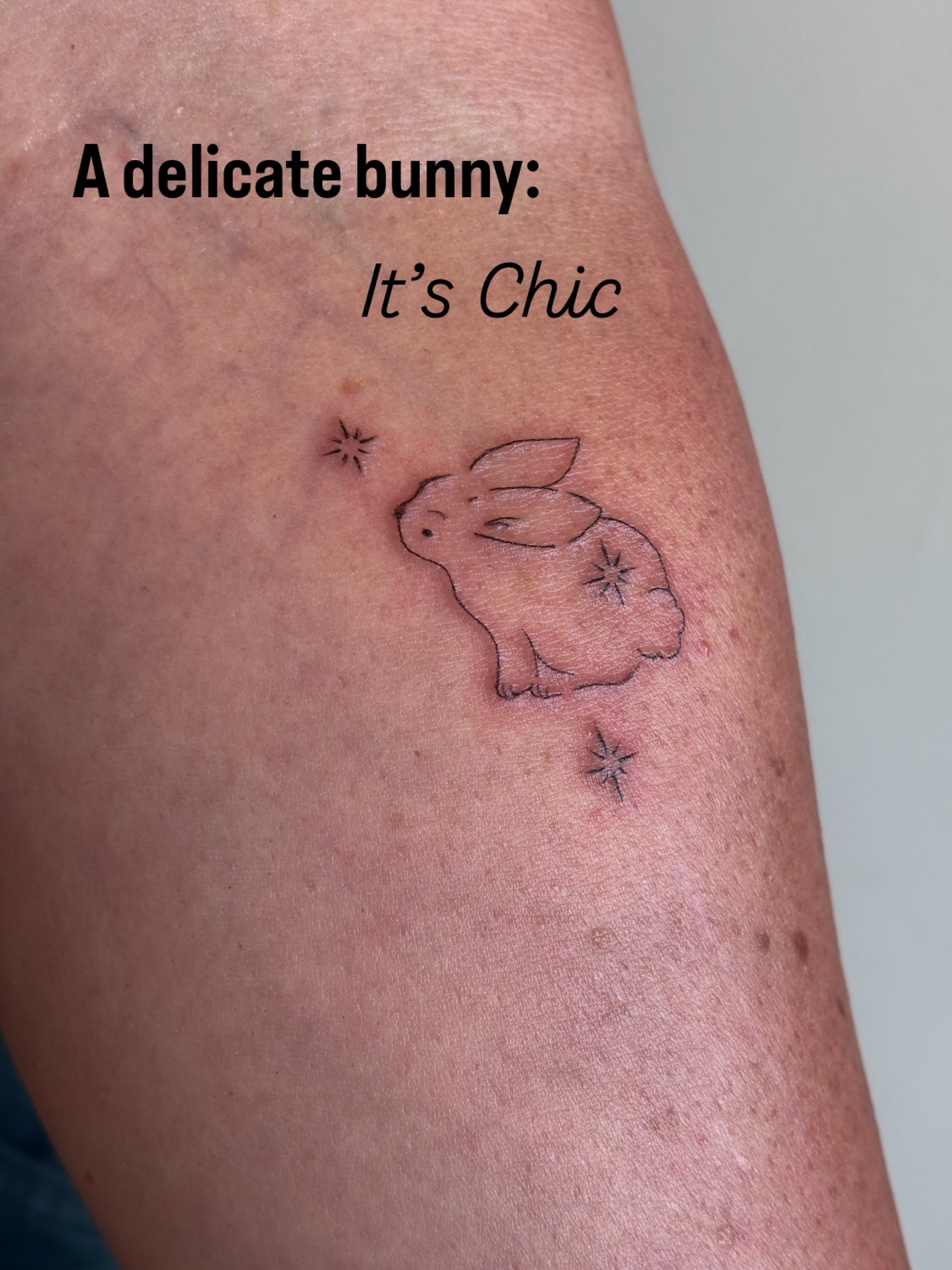 Delicate bunny minimalist tattoo on the thigh by Malissa