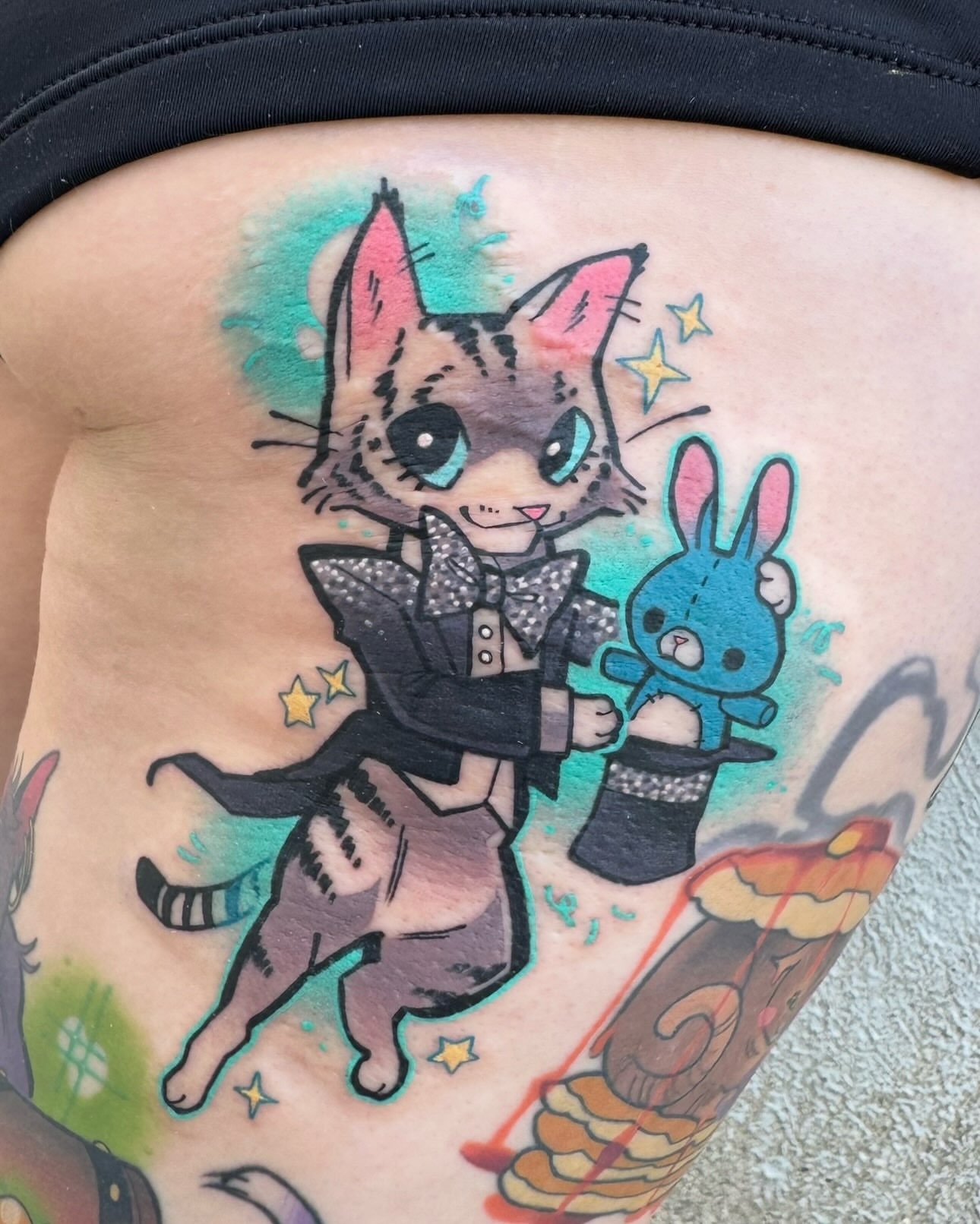 Cat magician with rabbit new school tattoo on the thigh by Taylor Nicoll Chunn