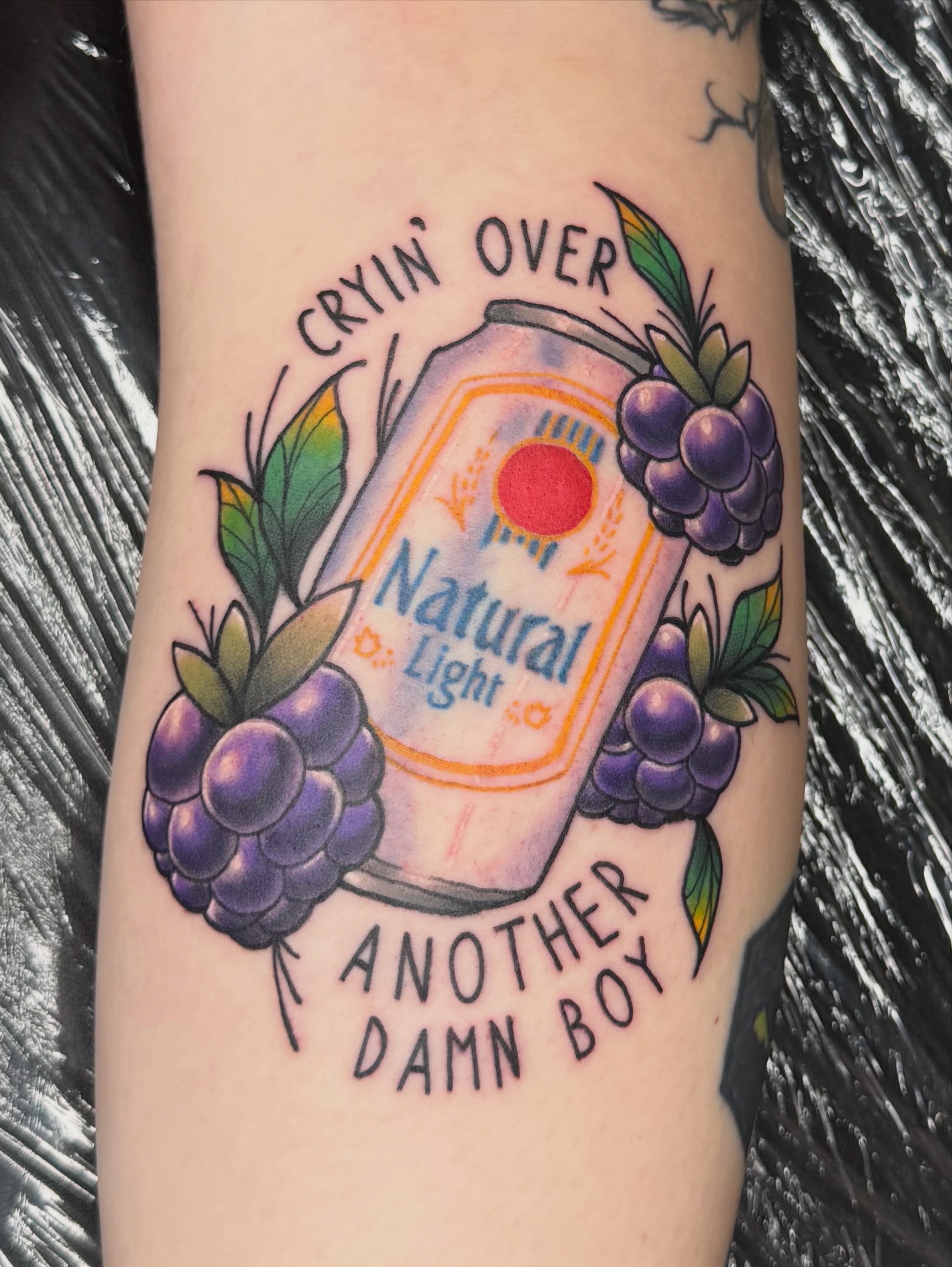 Natural Light beer can American traditional tattoo on the forearm by Jezza Munson