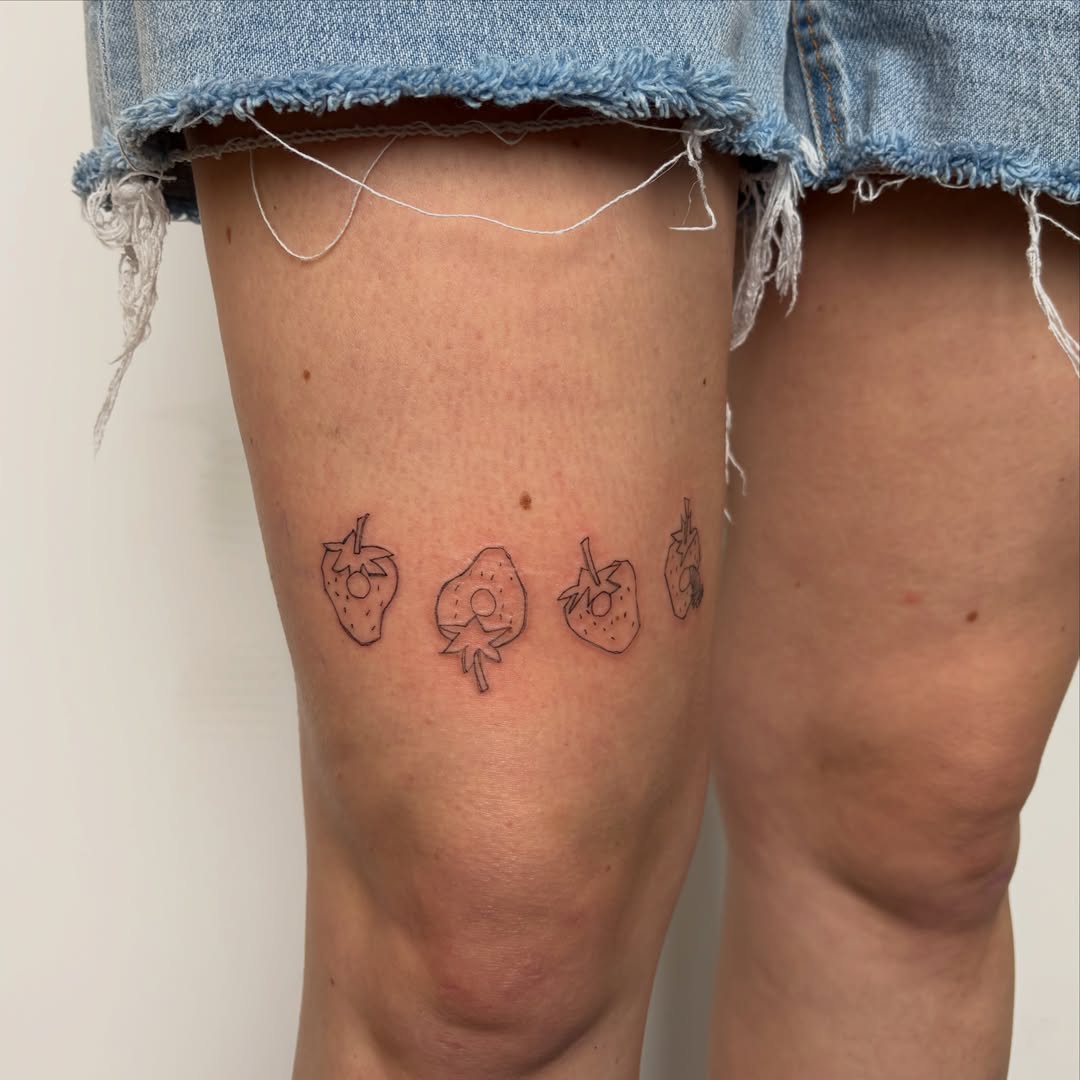 Strawberries fine line tattoo on the leg by annie’s tattoos ⭐꩜ .ᐟ