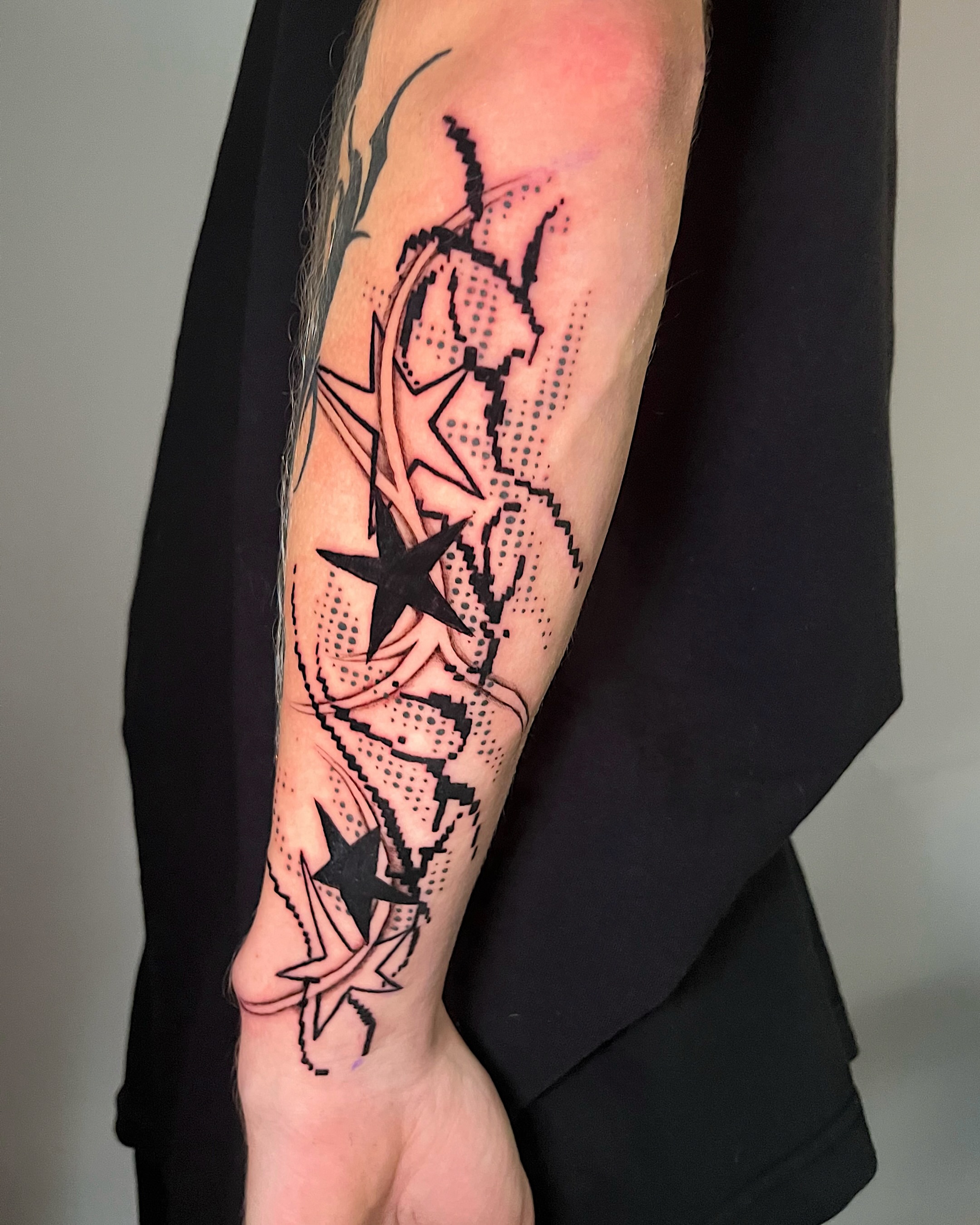 Stars and abstract shapes dotwork tattoo on the forearm by Azucena