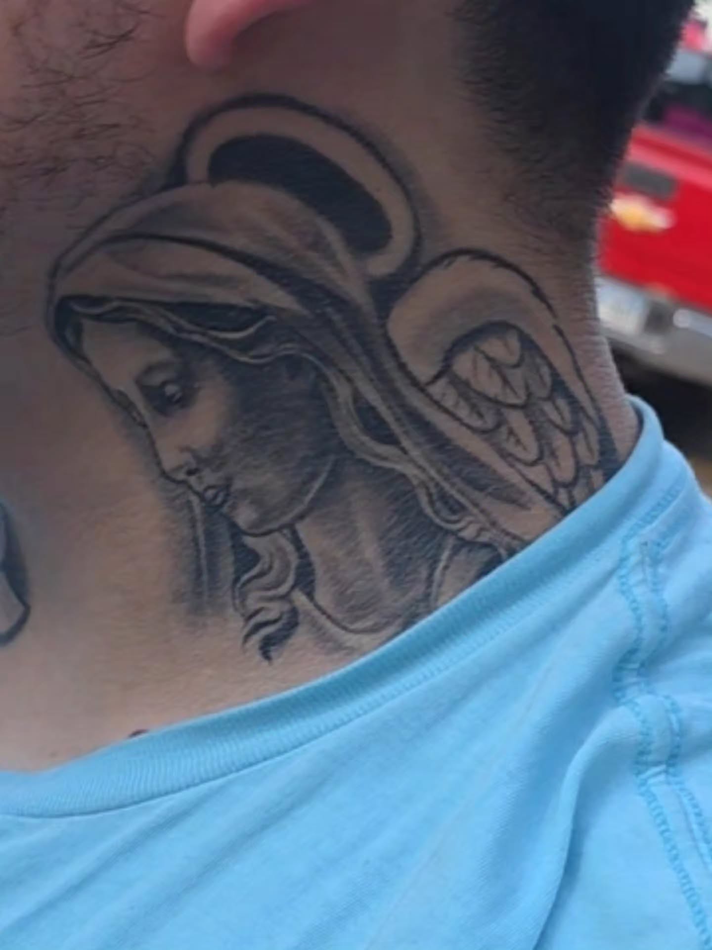 Religious figure black and grey tattoo on the neck by Tattoo Seez, Wichita, Kansas
