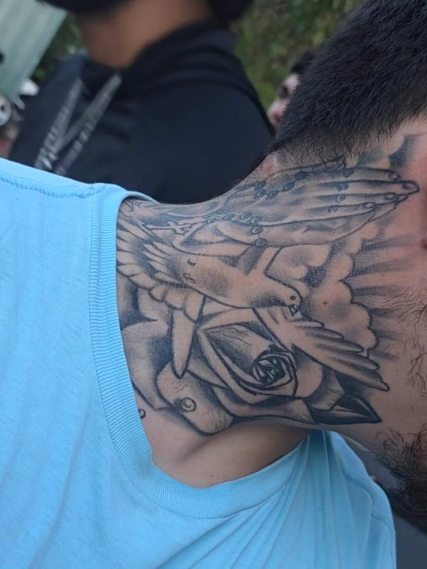 Doves and rose black and grey tattoo on the neck by Tattoo Seez, Wichita, Kansas