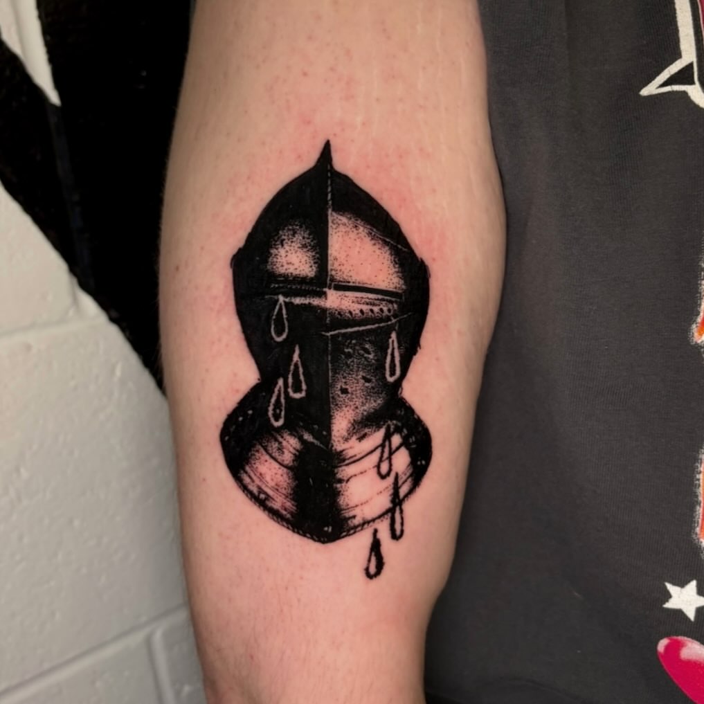 Helmet with dripping black and grey tattoo on the forearm by @lil_stinker_5000, Portland, Oregon