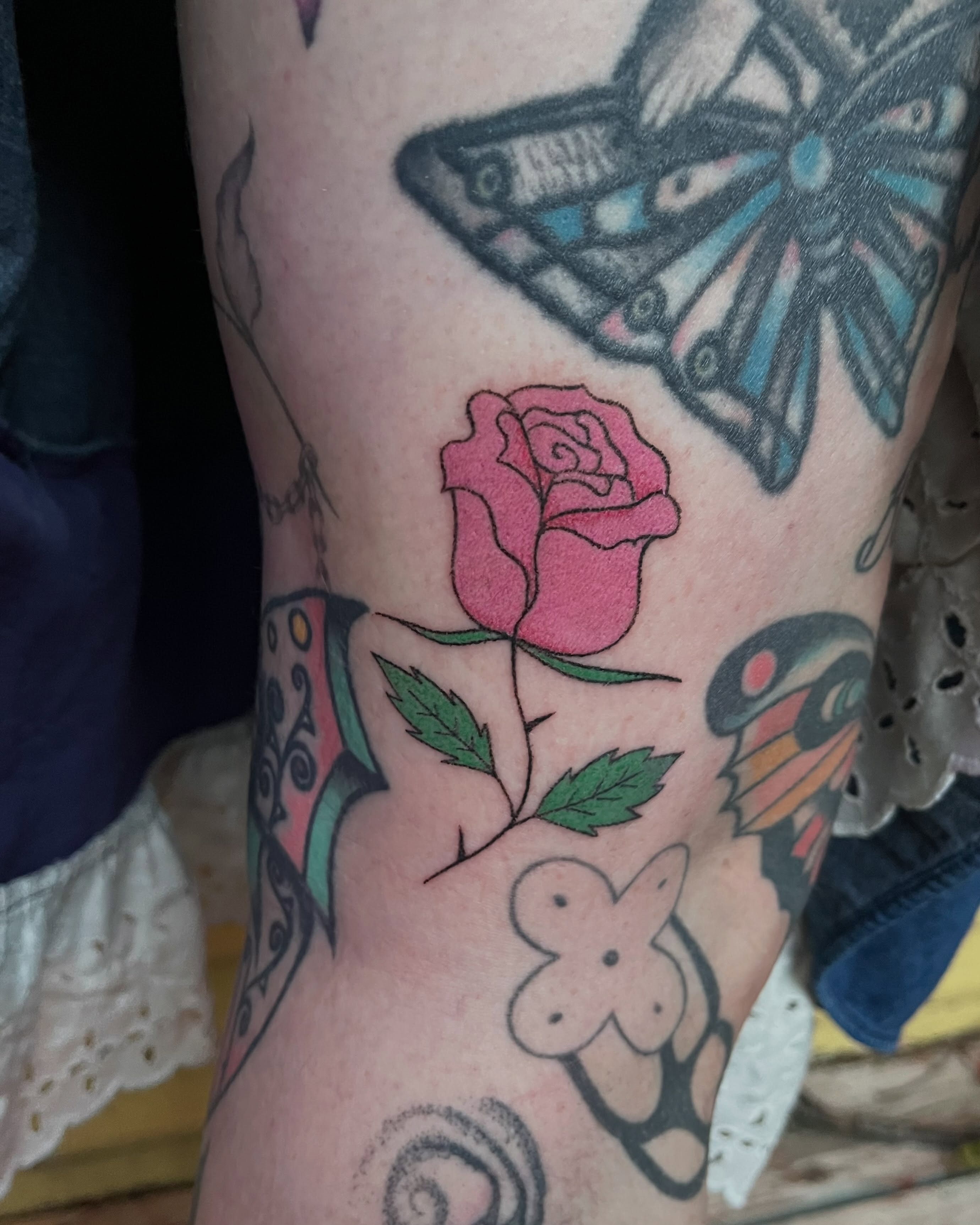 Rose American traditional tattoo on the forearm by Jenna
