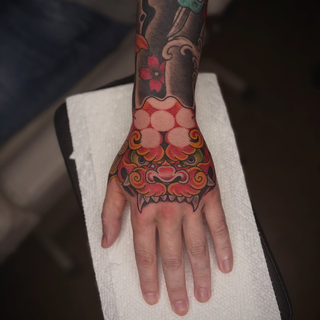 Mask japanese irezumi tattoo on the hand by Lauren Dempsey, Dearborn, Michigan