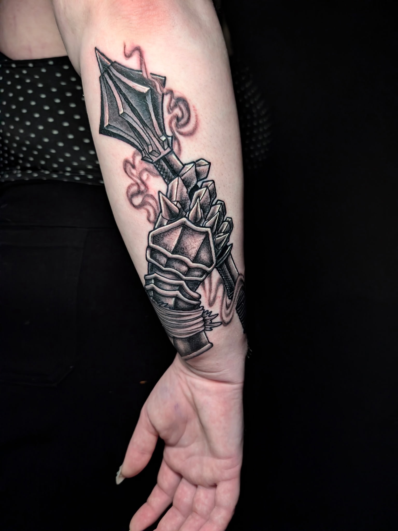 Gemstone and dagger realism tattoo on the forearm by Gina Carlson