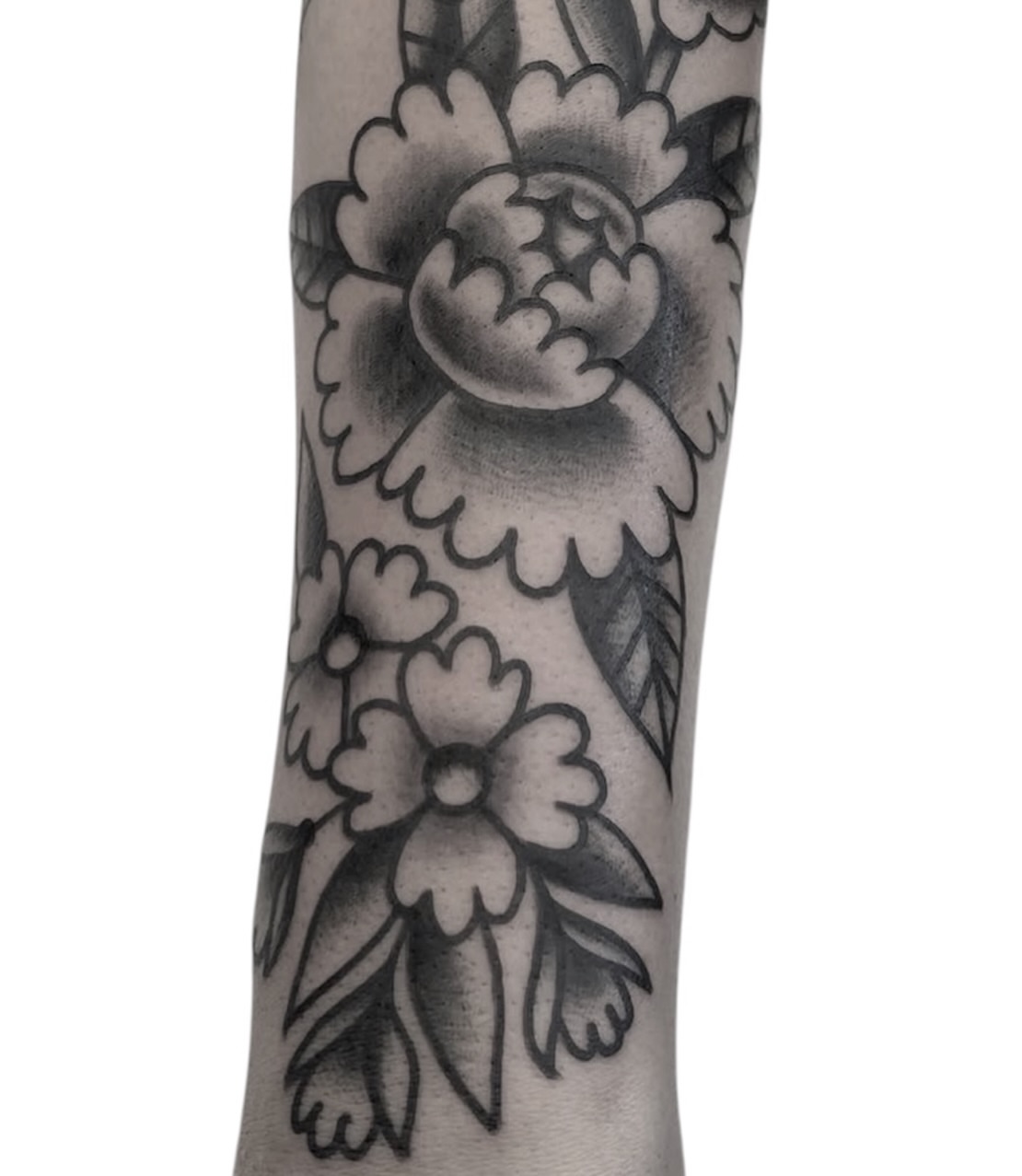 Floral design American traditional tattoo on the forearm by Chris Martin