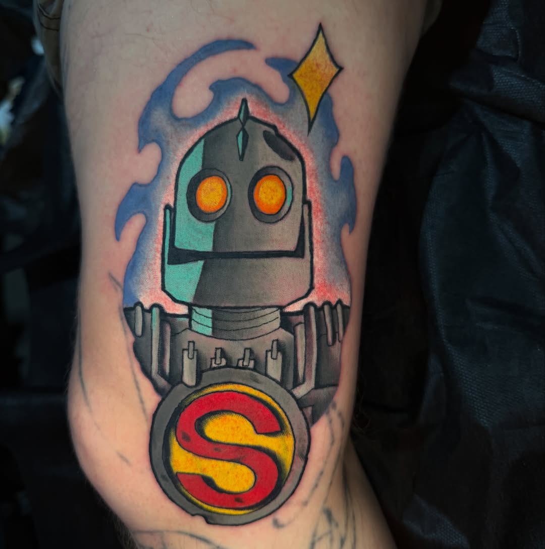 Robot with 'S' emblem new school tattoo on the forearm by James Mullin