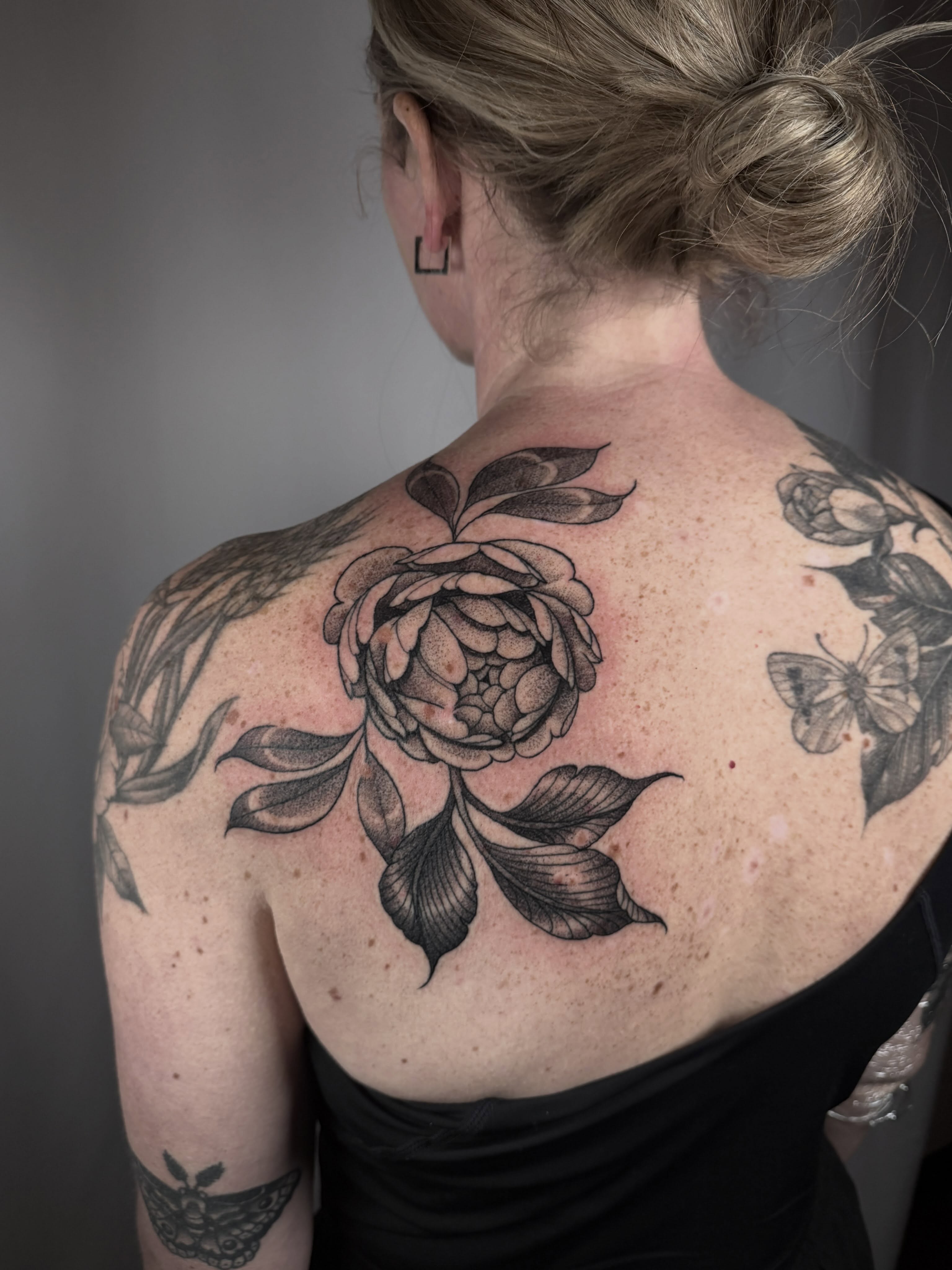 Peony flower black and grey tattoo on the back by leanna patterson, Ruston, Louisiana