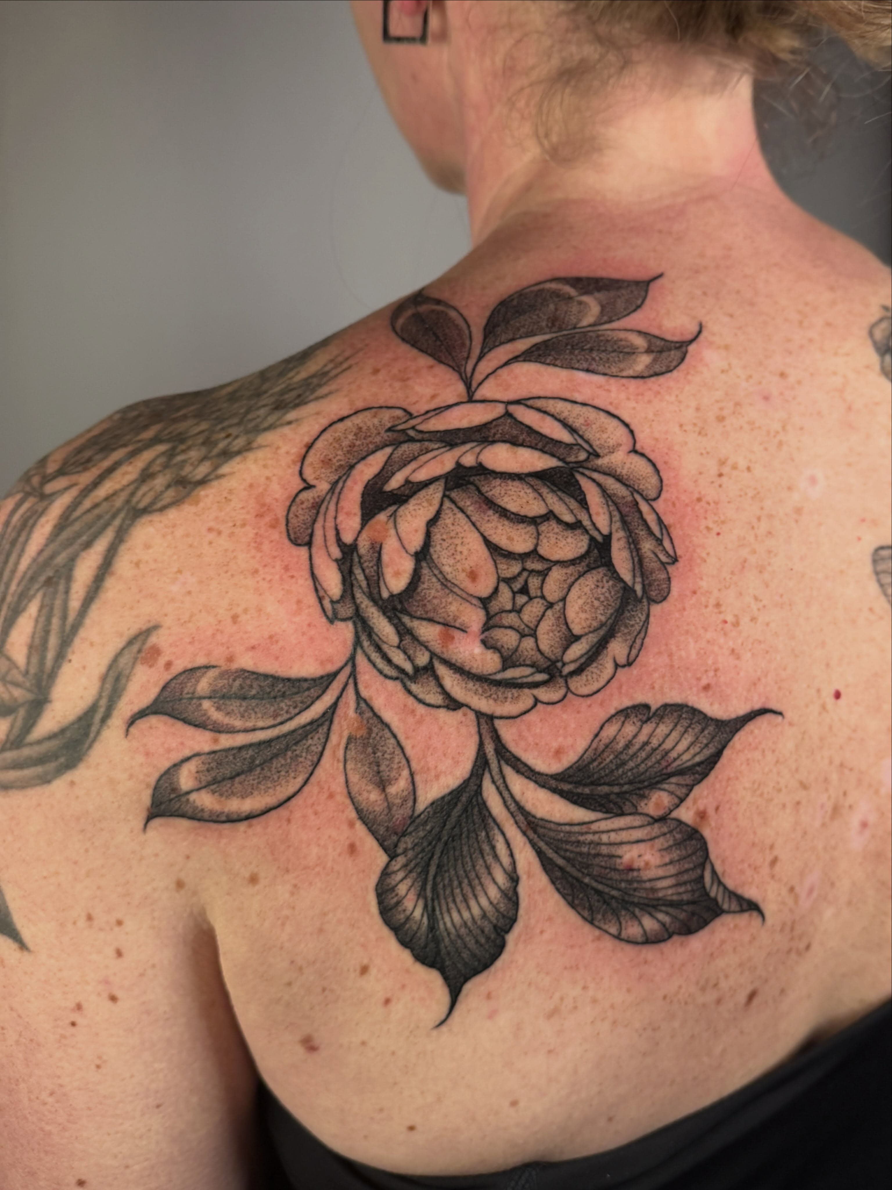 Peony black and grey tattoo on the back by leanna patterson, Ruston, Louisiana