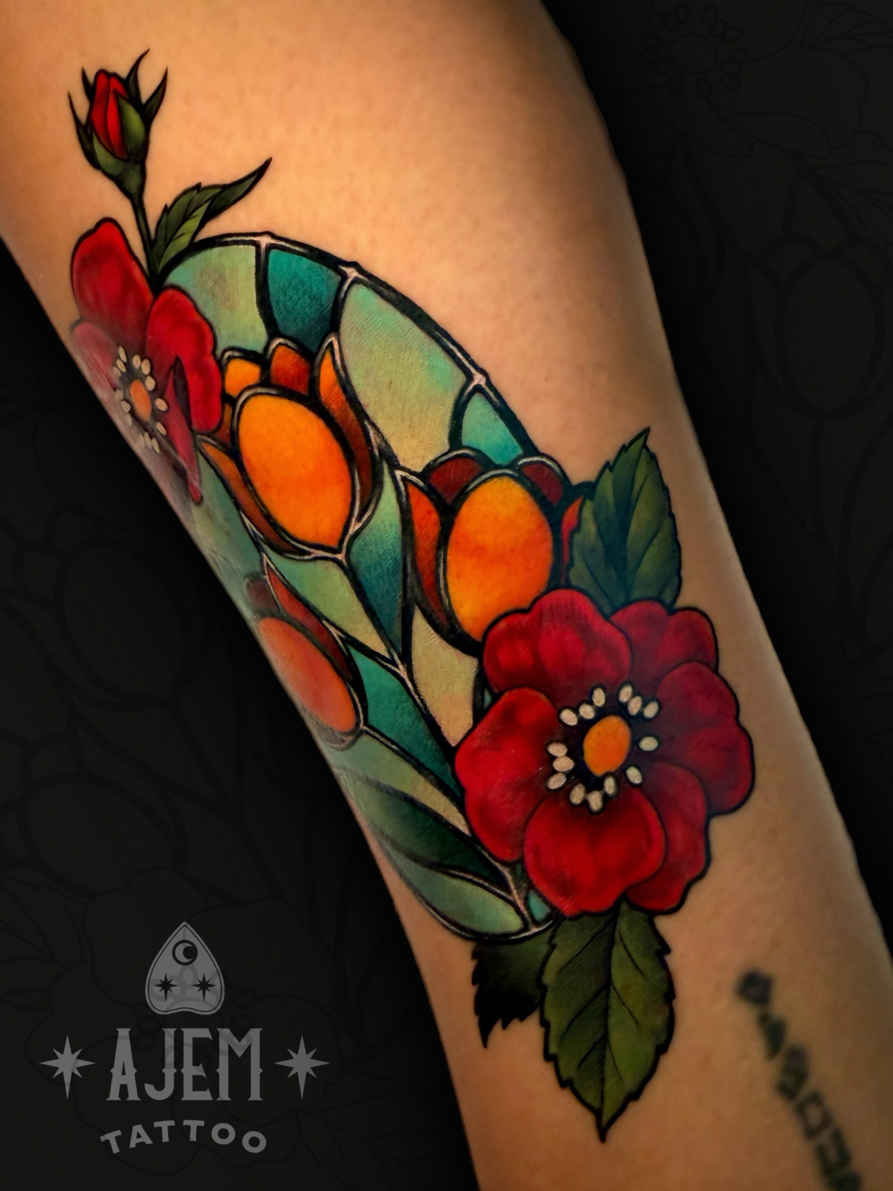 Flowers American traditional tattoo on the forearm by Ash MacIsaac