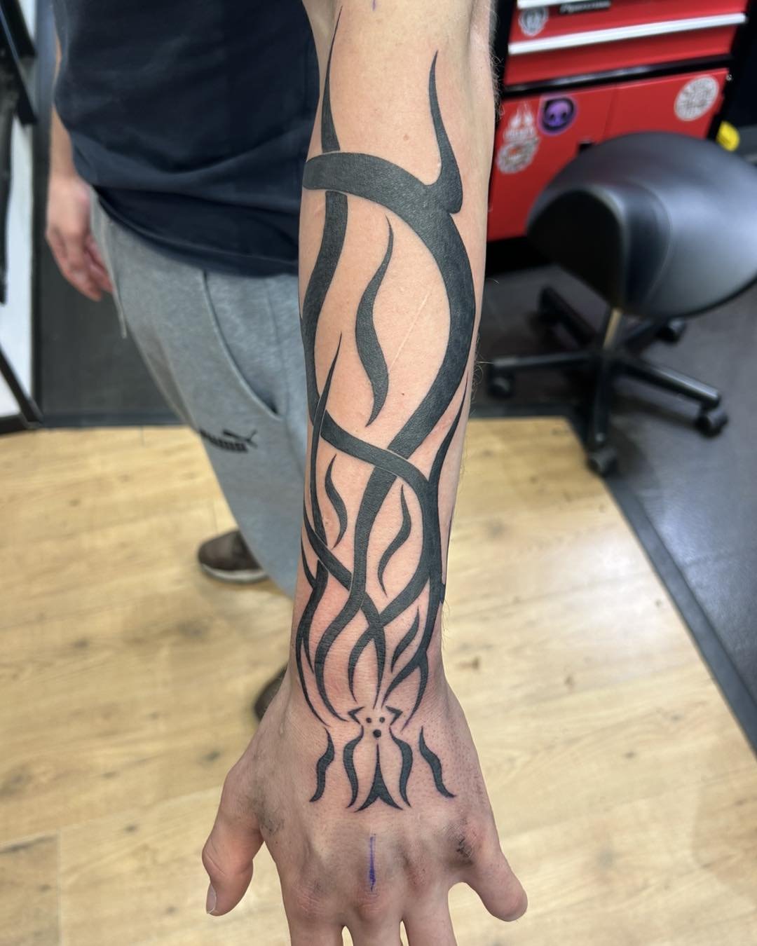 Flame tribal tattoo on the forearm by Room 5 Tattoo