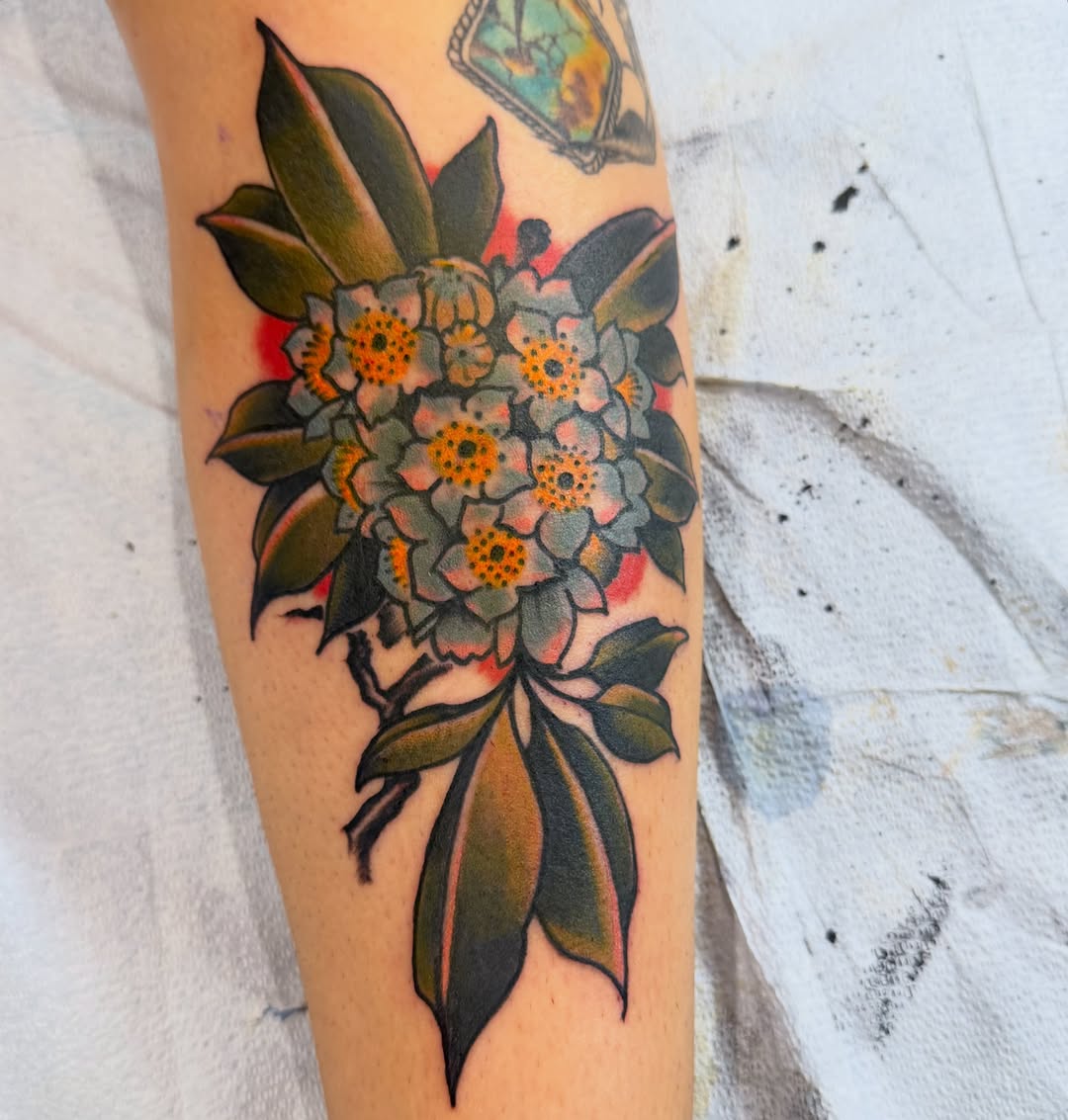 Flower bouquet American traditional tattoo on the forearm by Brian DiCola Tattooer