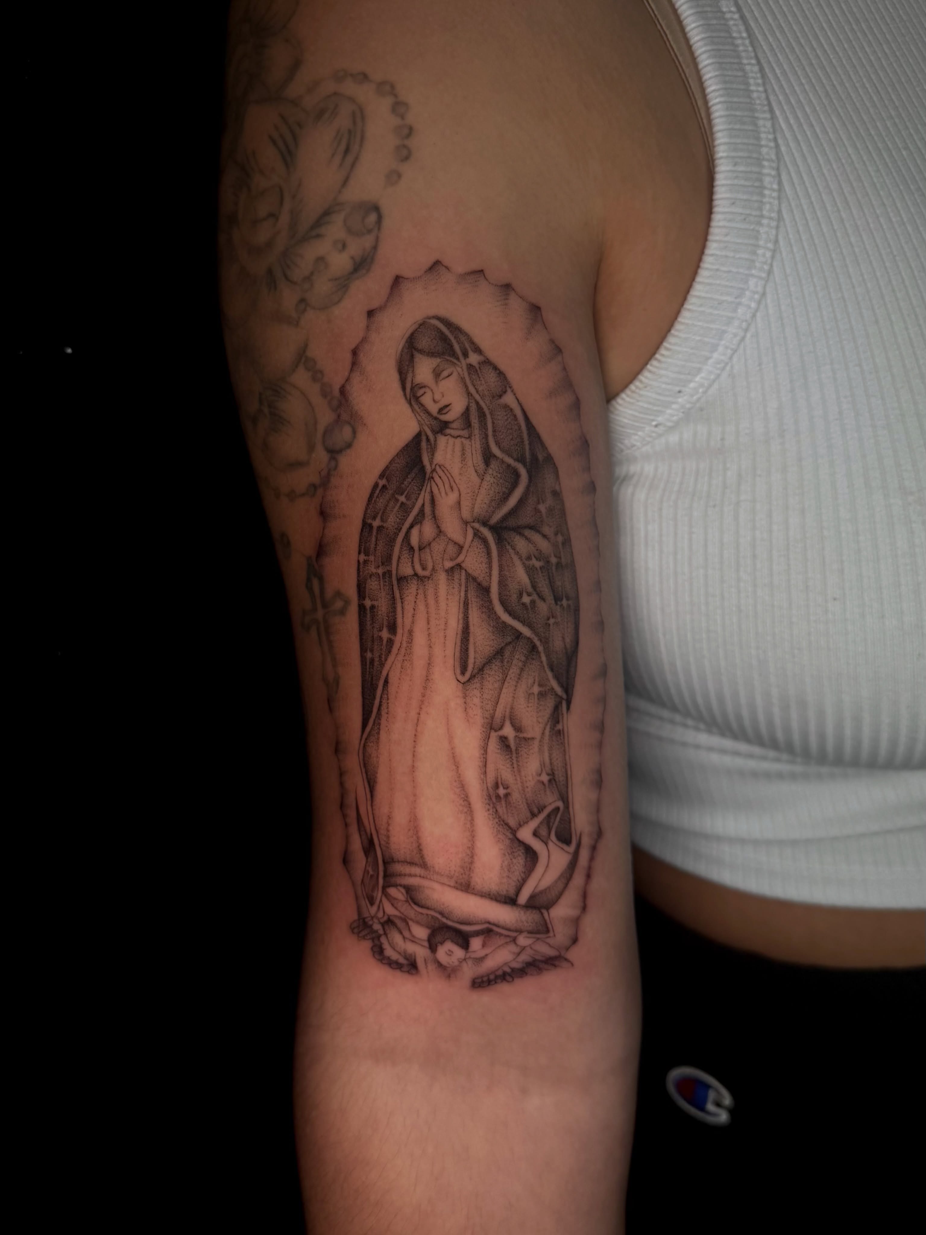 Virgin mary black and grey tattoo on the forearm by Alexa Camacho