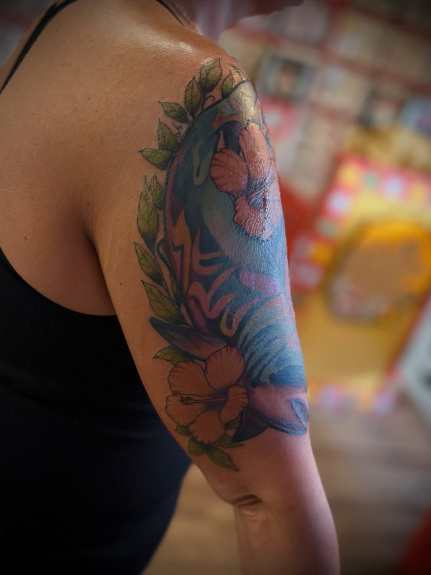 Floral design new school tattoo on the upper arm by Justin Bianchini - New Orleans Tattoo Artist