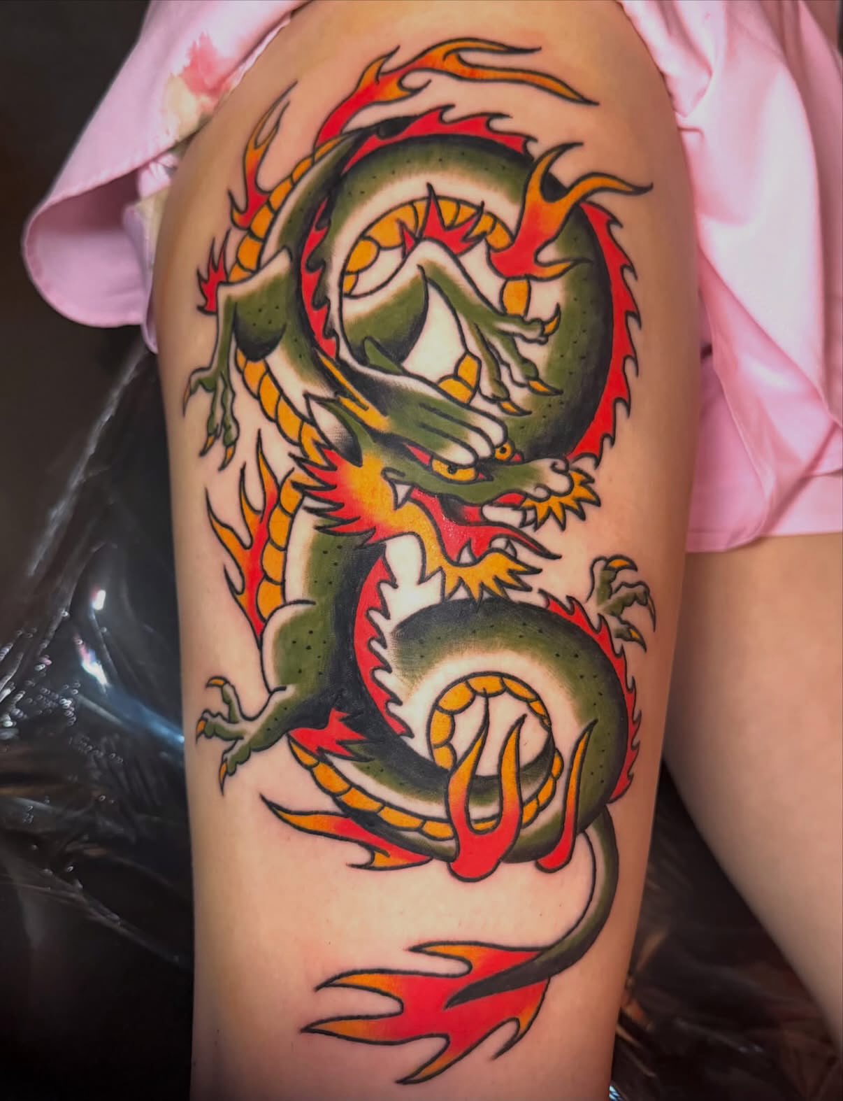 Dragon new school tattoo on the thigh by Kelsey Turnis