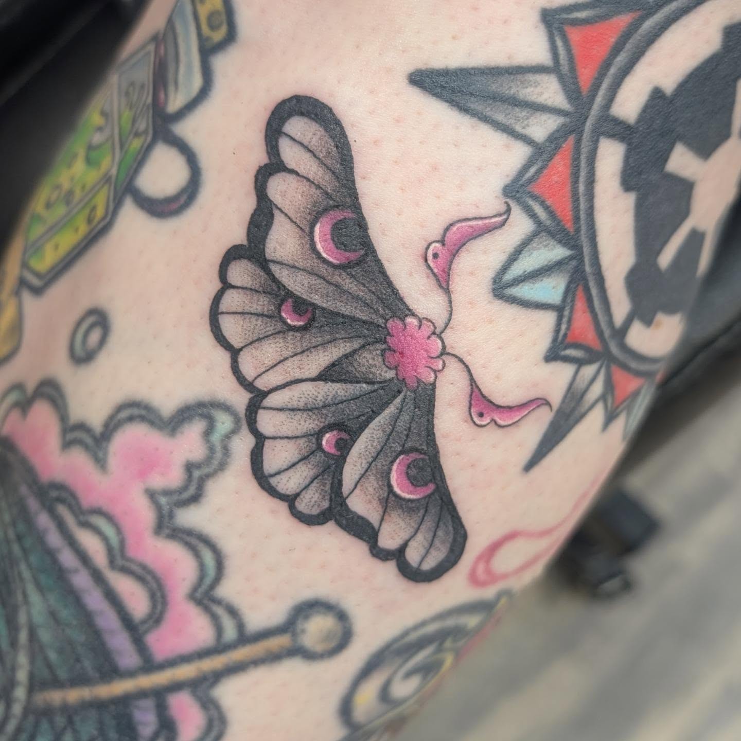 Butterfly American traditional tattoo on the upper arm by Talia Zula, Loveland, Ohio