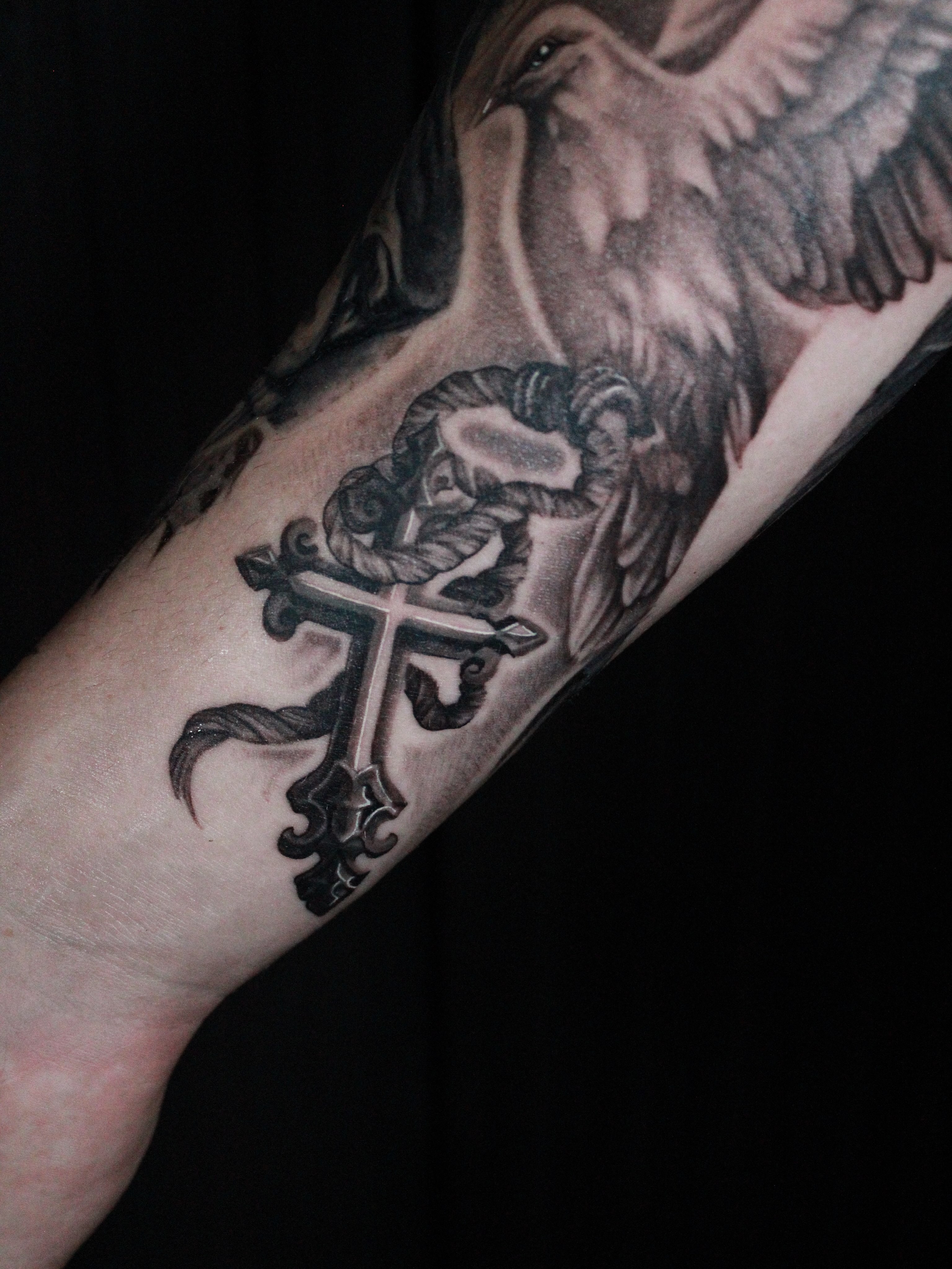 Cross with ornate details realism tattoo on the forearm by 𝕵𝖎𝖒𝖎 𝕯𝖊𝕽𝖔𝖘𝖆🥀, Everett, Washington