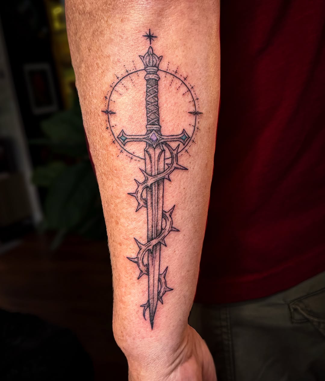 Sword and thorns black and grey tattoo on the forearm by Ash✨