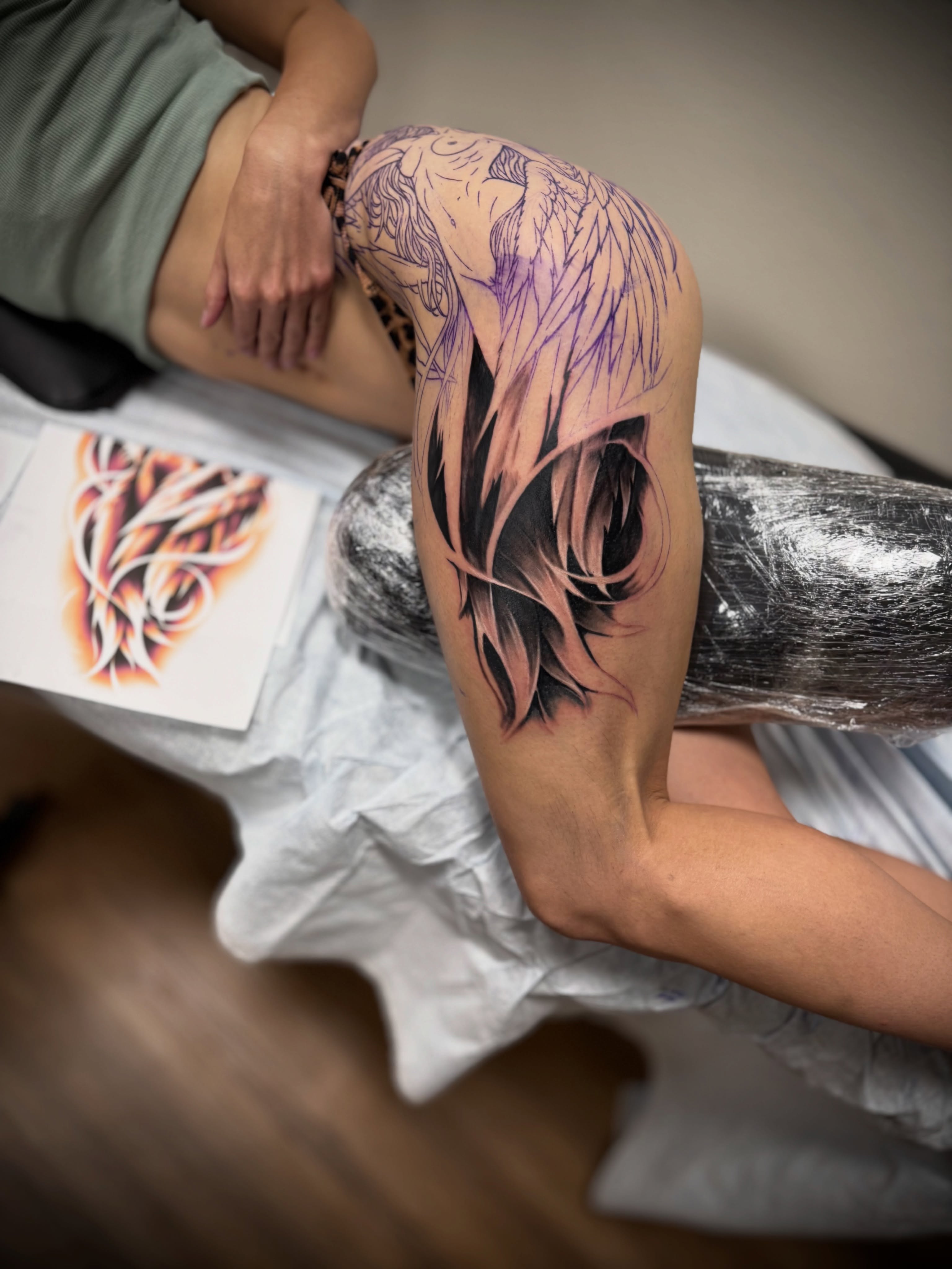 Flame new school tattoo on the thigh by Julian Olson