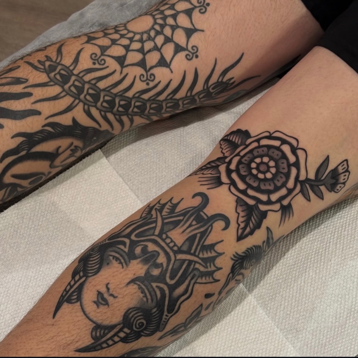 Woman's face with horns American traditional tattoo on the forearm by Erin Chambers