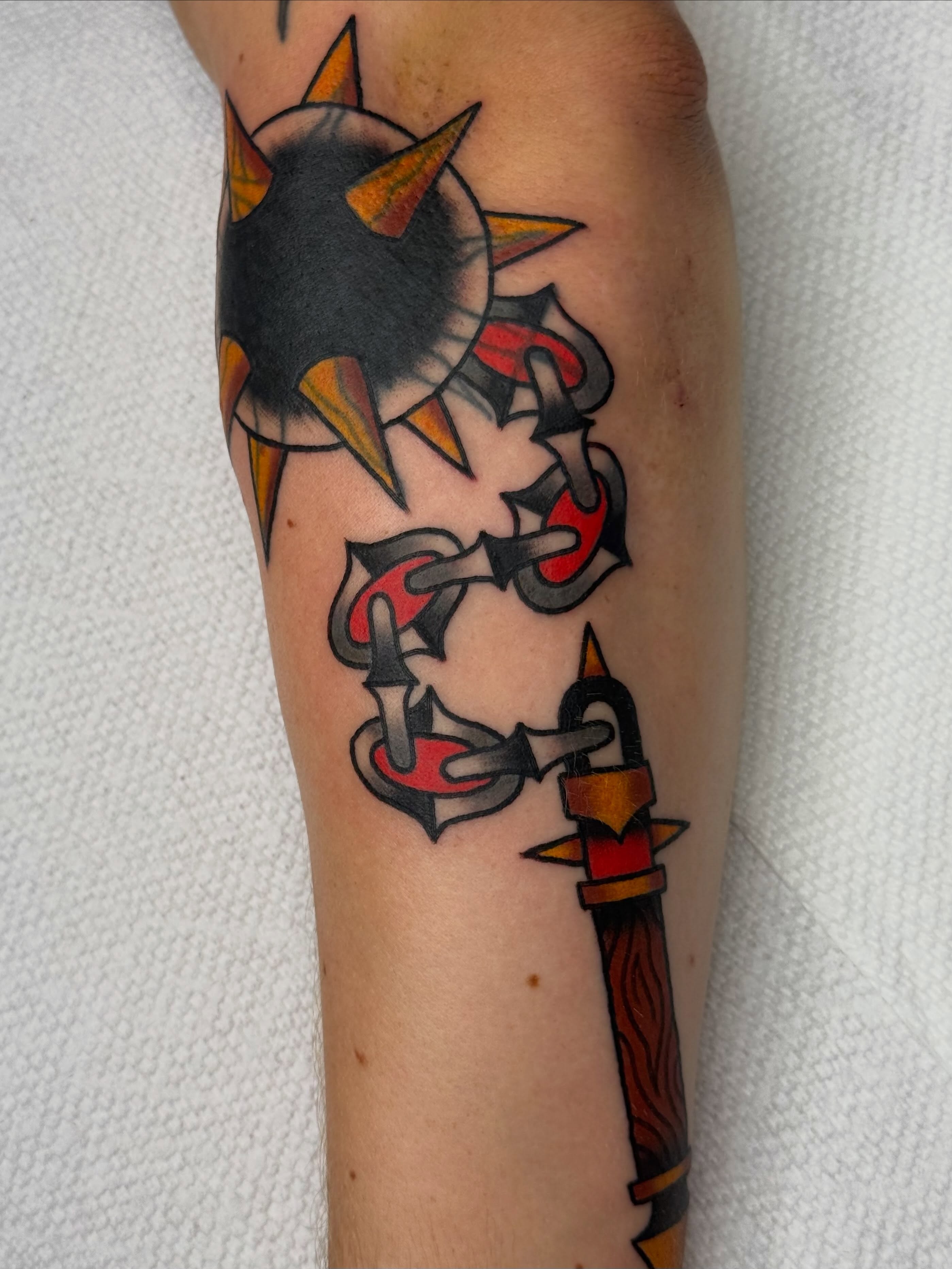 Chains and sun American traditional tattoo on the forearm by Emma Eaton