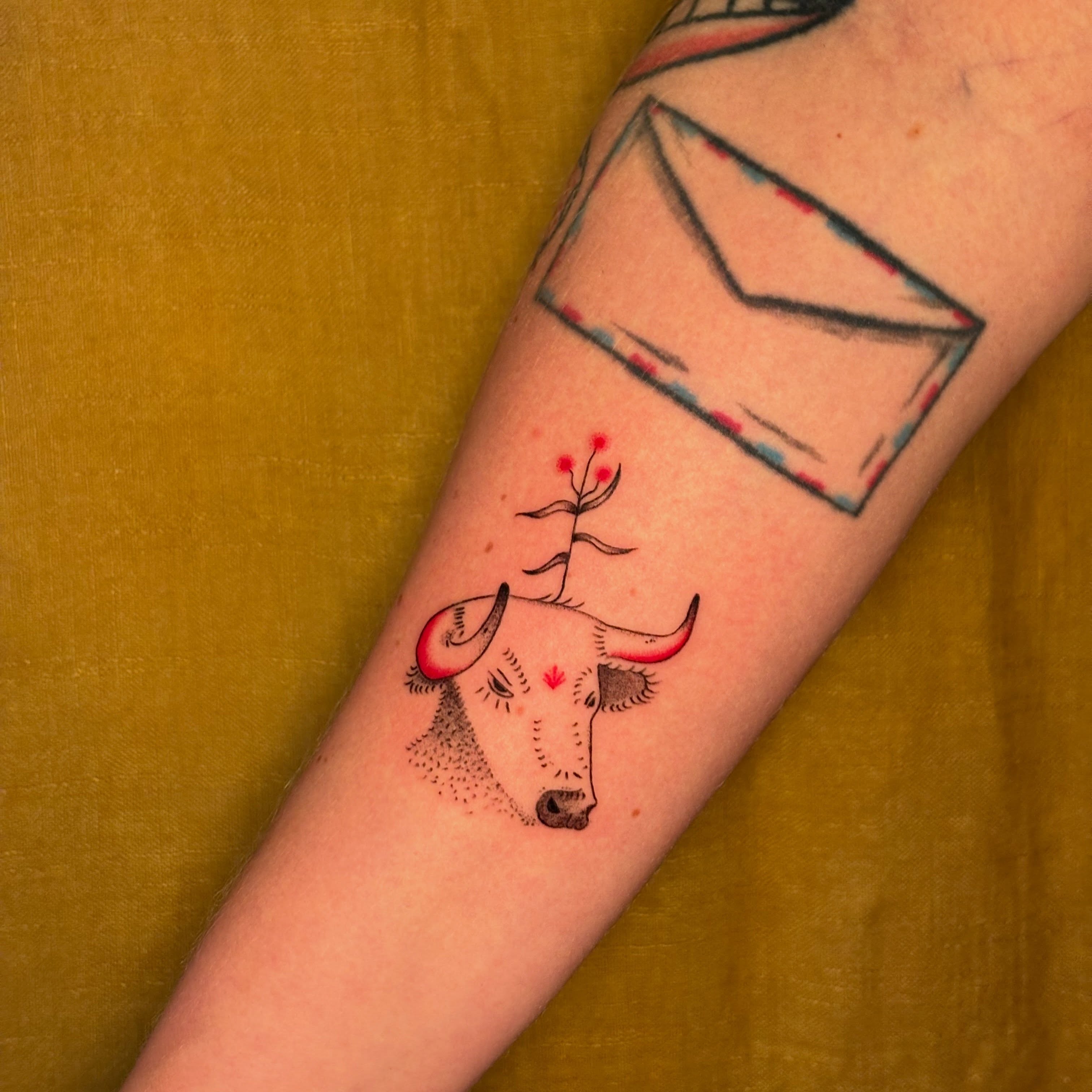 Bull with plant dotwork tattoo on the forearm by carla sofia