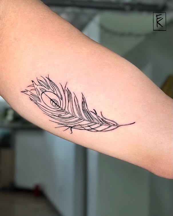Peacock feather fine line tattoo on the forearm by elizaveta