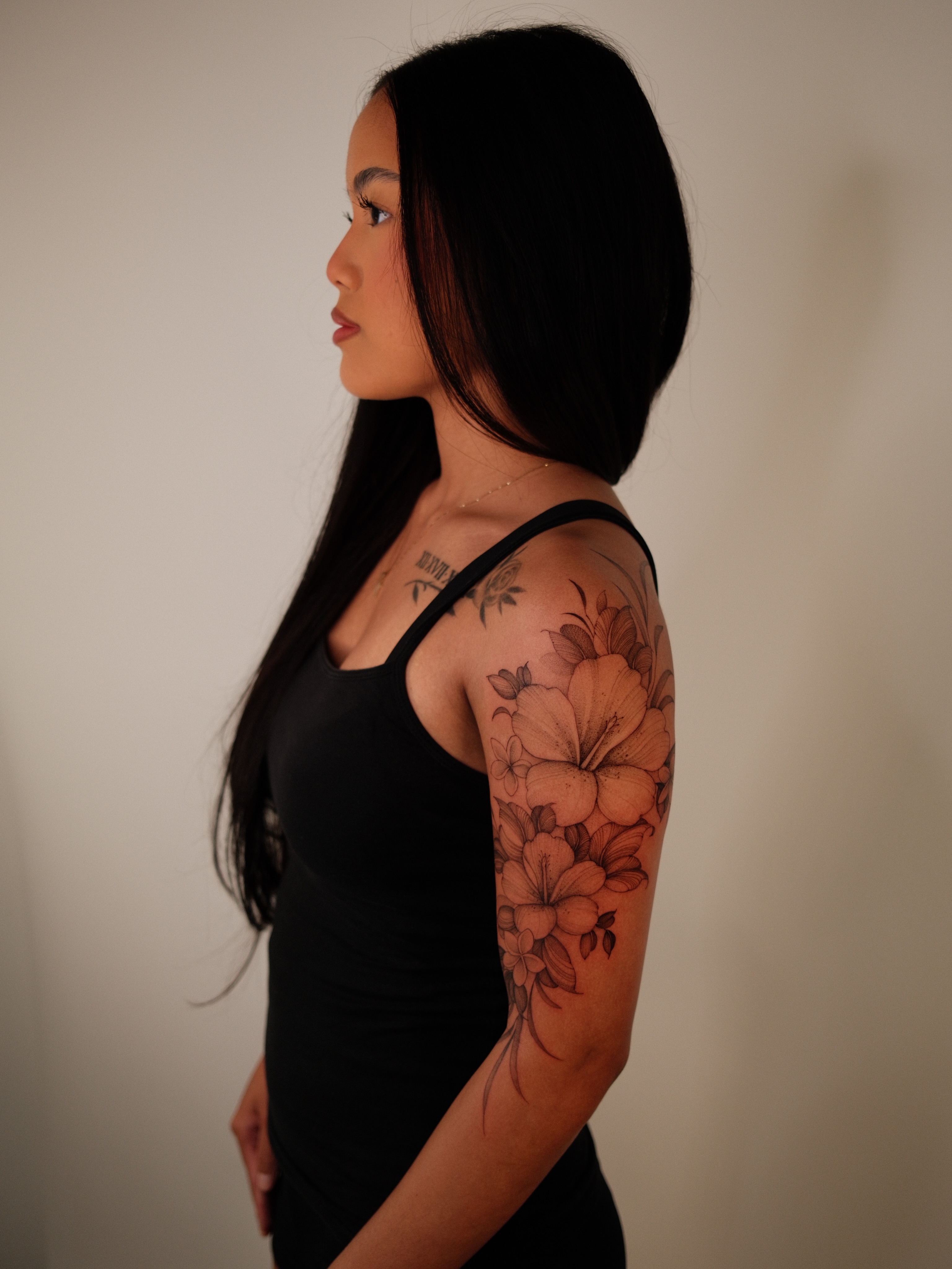 Floral bouquet black and grey tattoo on the upper arm by LORIE π€ Floral Tattoo Artist, Los Angeles, California