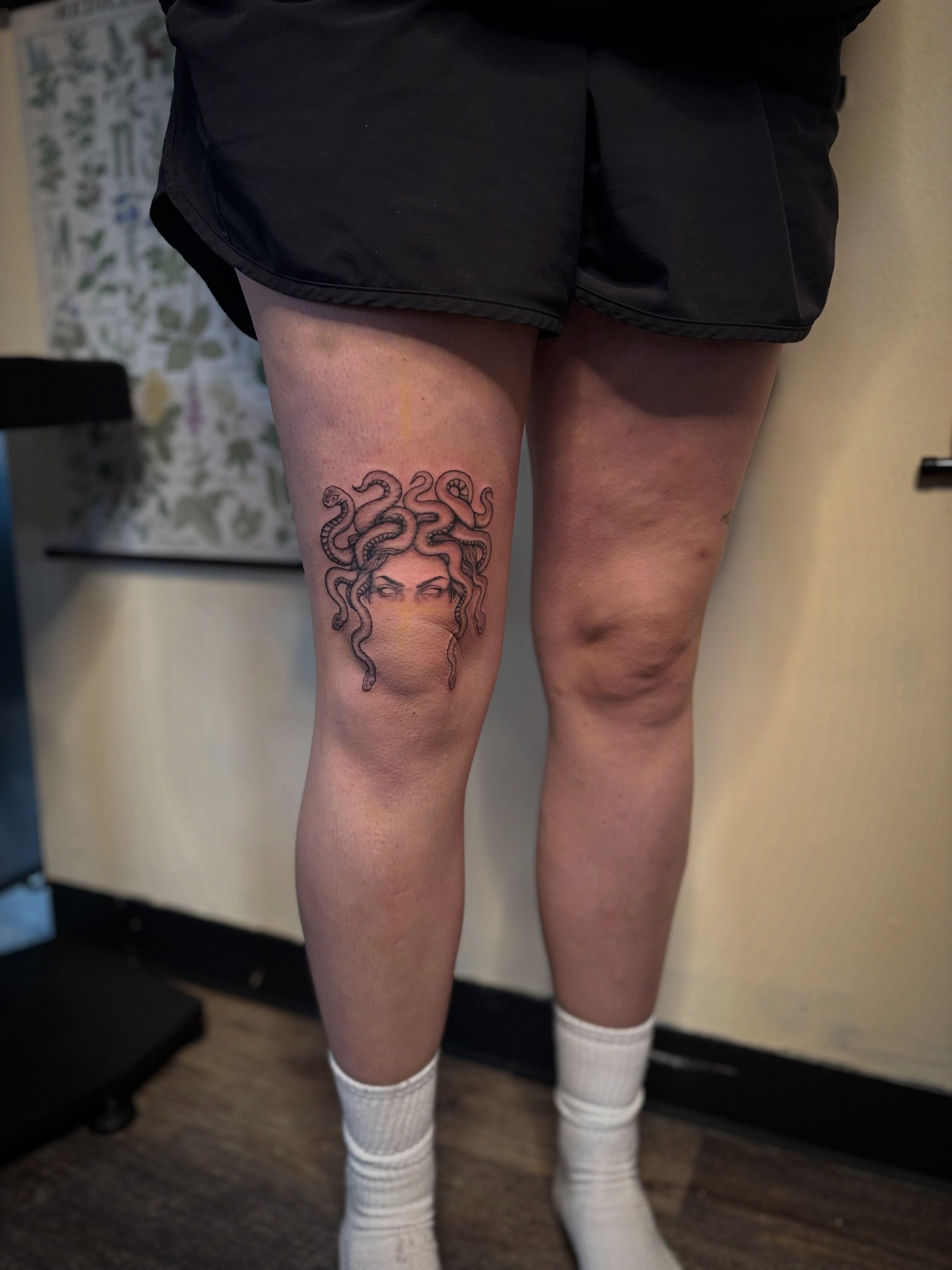 Medusa black and grey tattoo on the thigh by Tessa Simmons - Tattoo Artist
