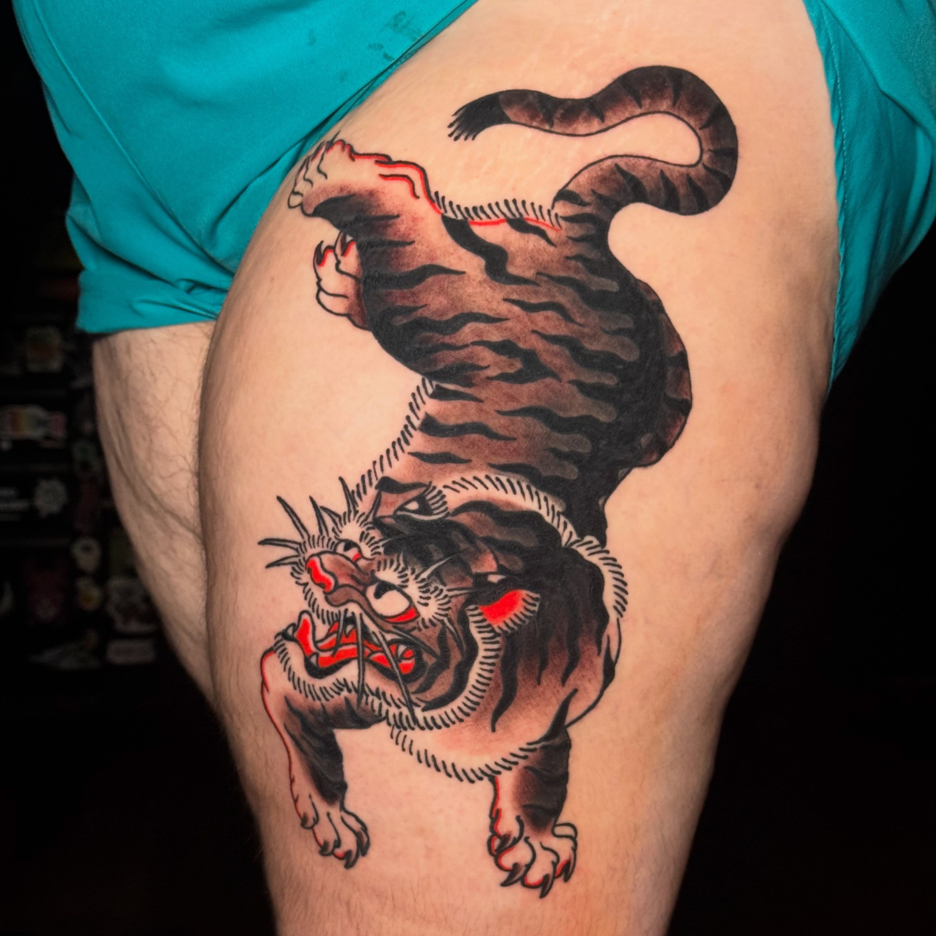 Tiger American traditional tattoo on the thigh by Matthew - Tattoo Artist
