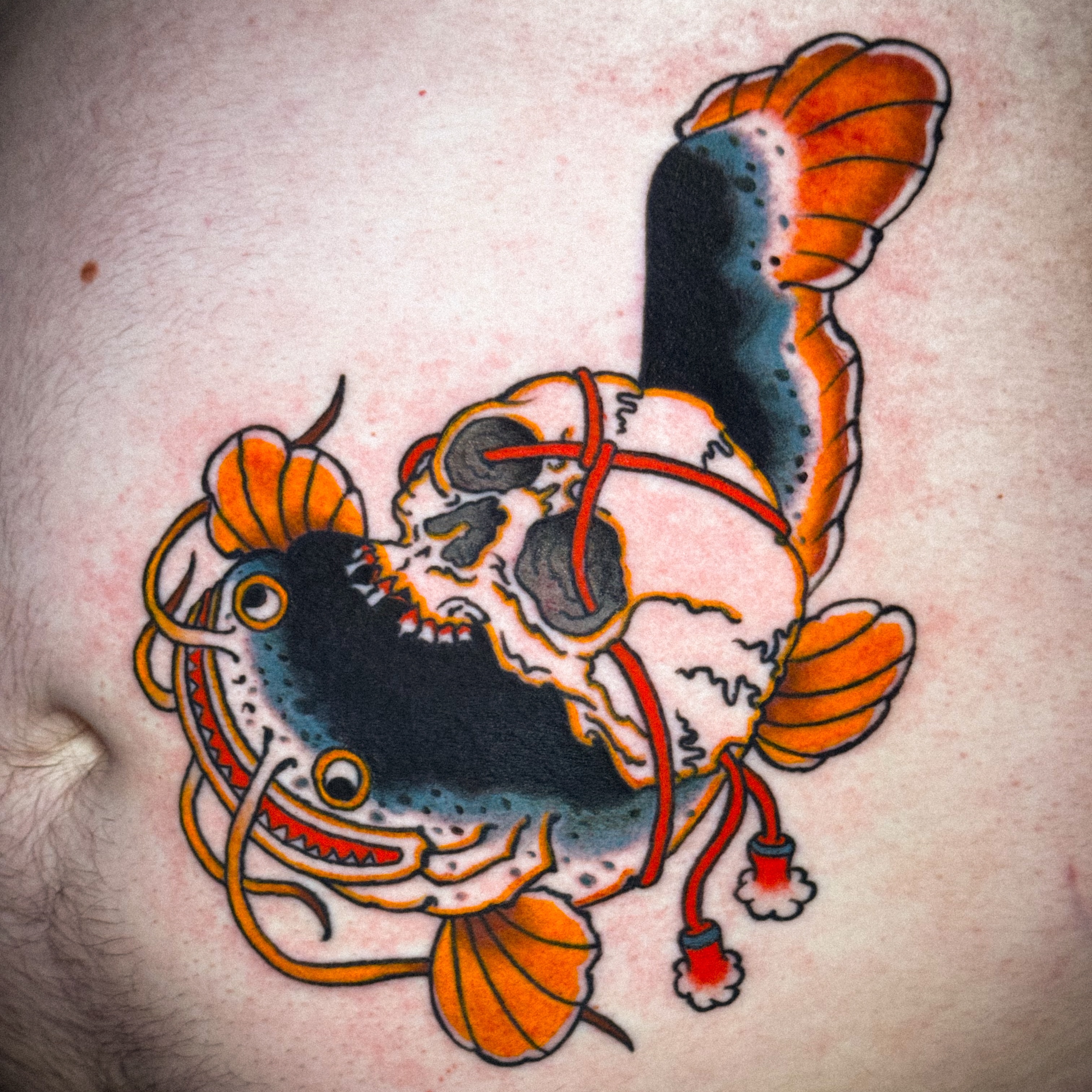 Skull with tentacles American traditional tattoo on the torso by Matthew - Tattoo Artist