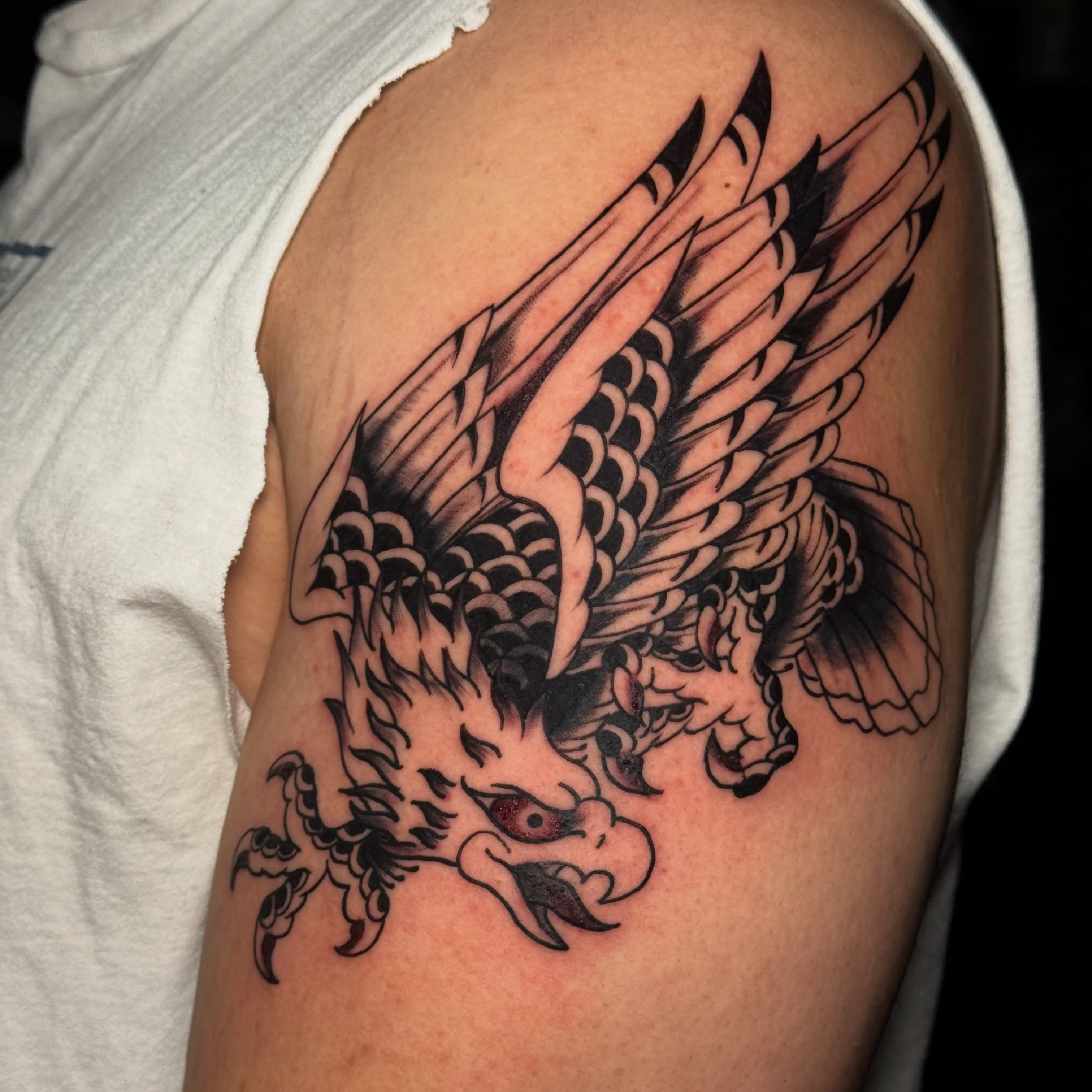 Eagle American traditional tattoo on the shoulder by Matthew - Tattoo Artist