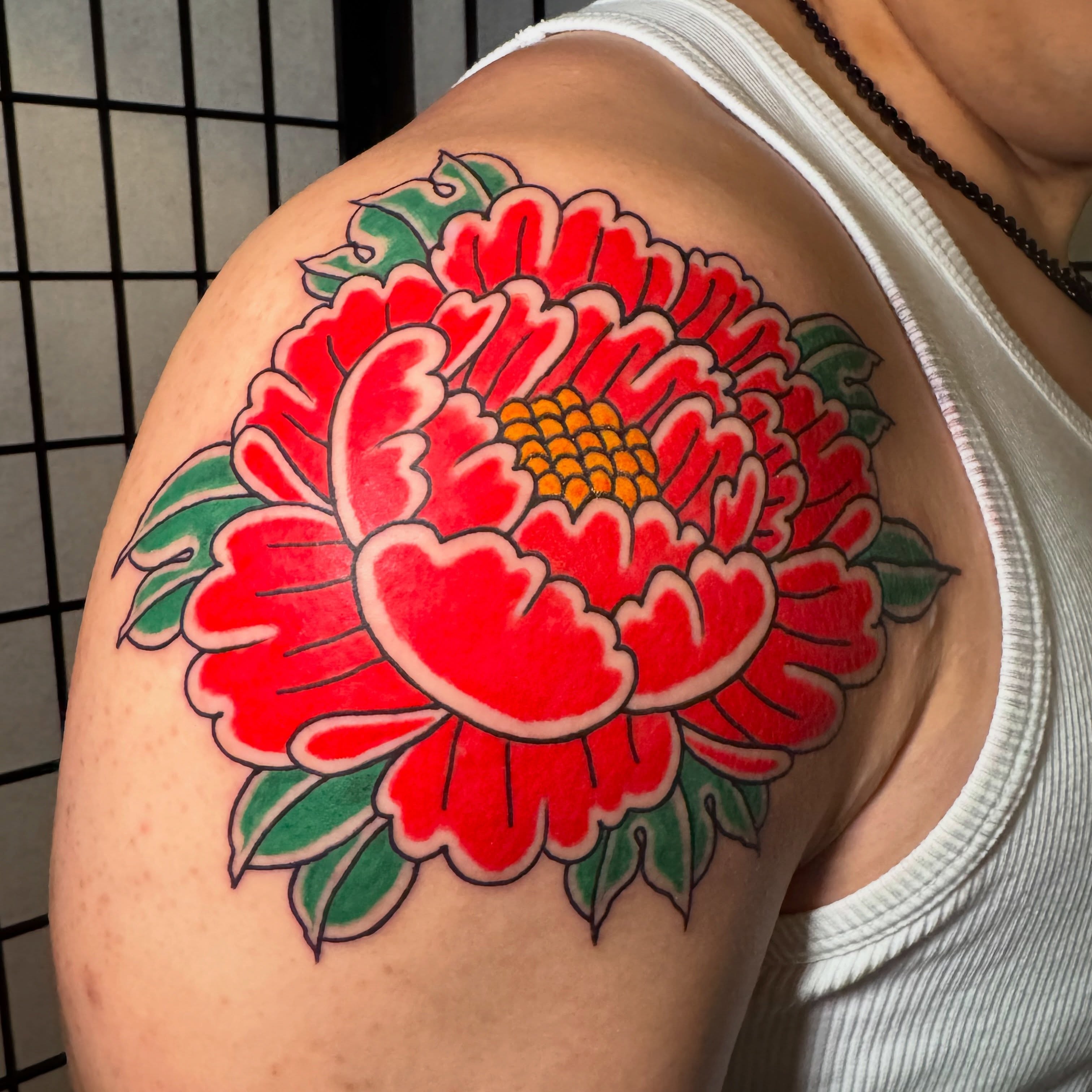 Peony American traditional tattoo on the shoulder by Matthew - Tattoo Artist