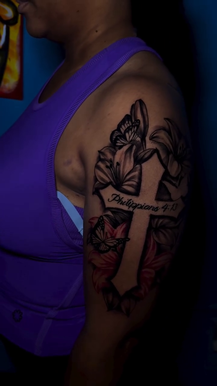 Cross with lilies and butterflies realism tattoo by Dope