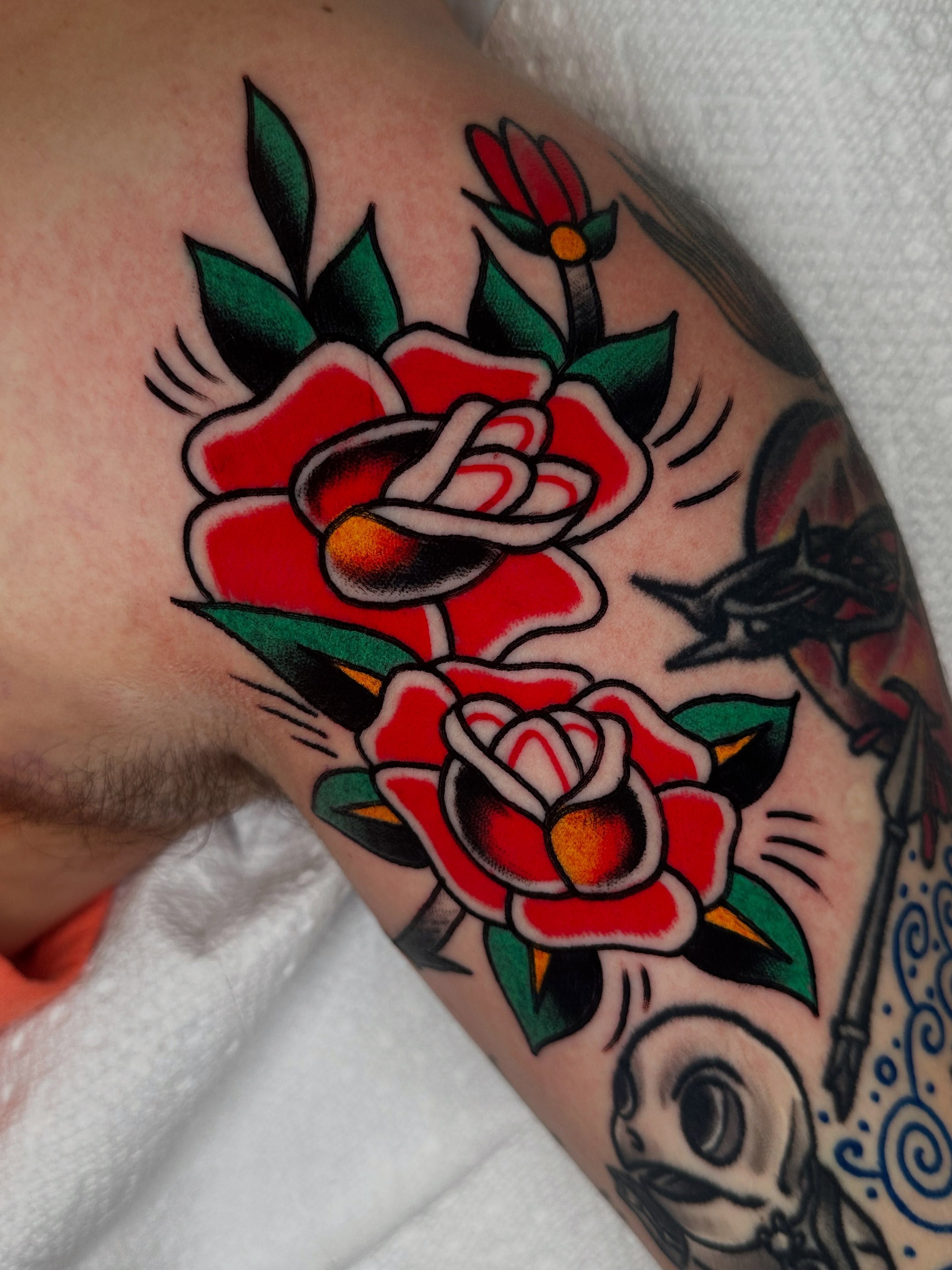 Roses American traditional tattoo on the shoulder by Spencer Crawford, Speedway, Indiana