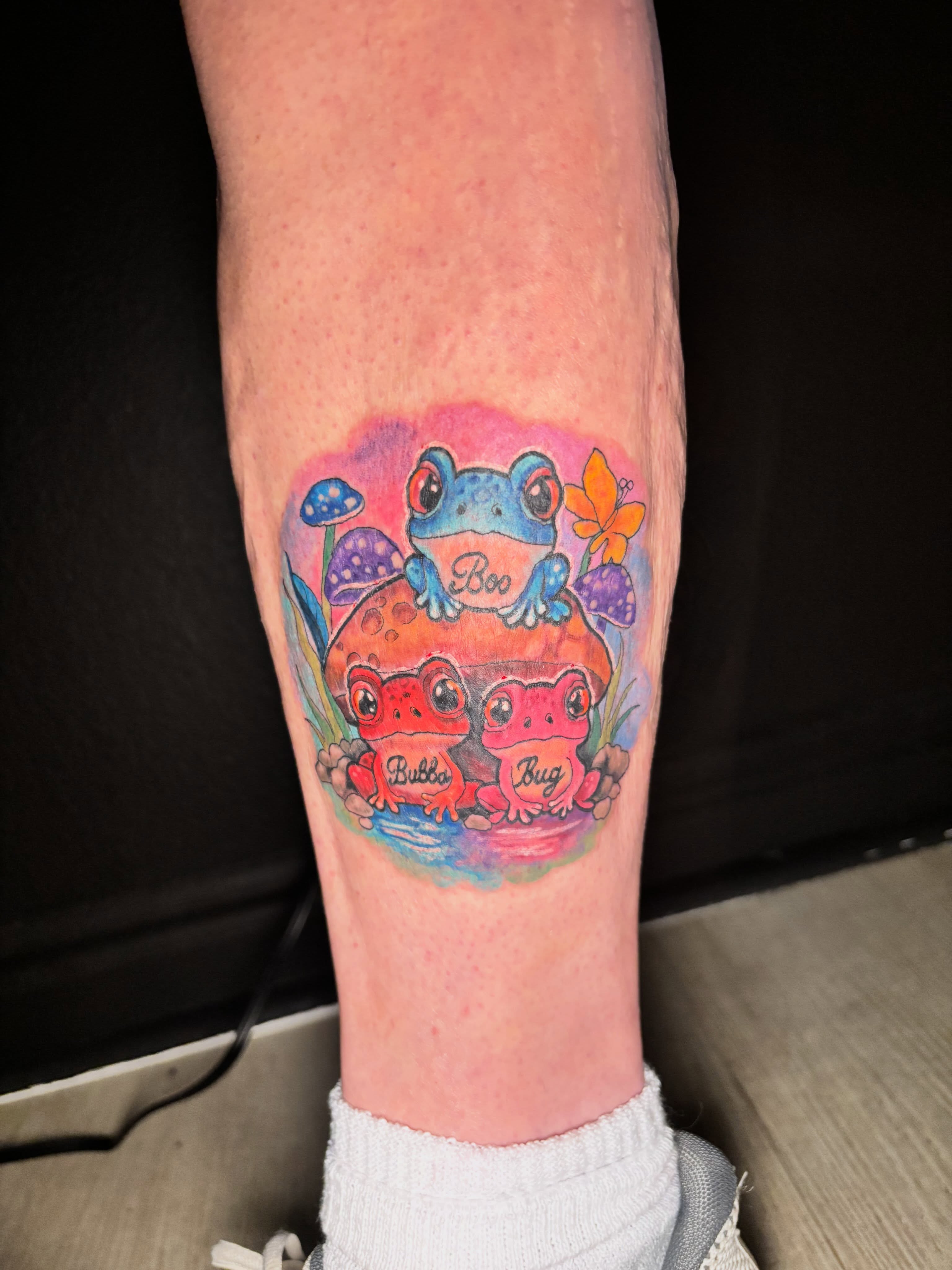 Frogs and mushrooms watercolor tattoo on the forearm by Taylor Tha Color Queen