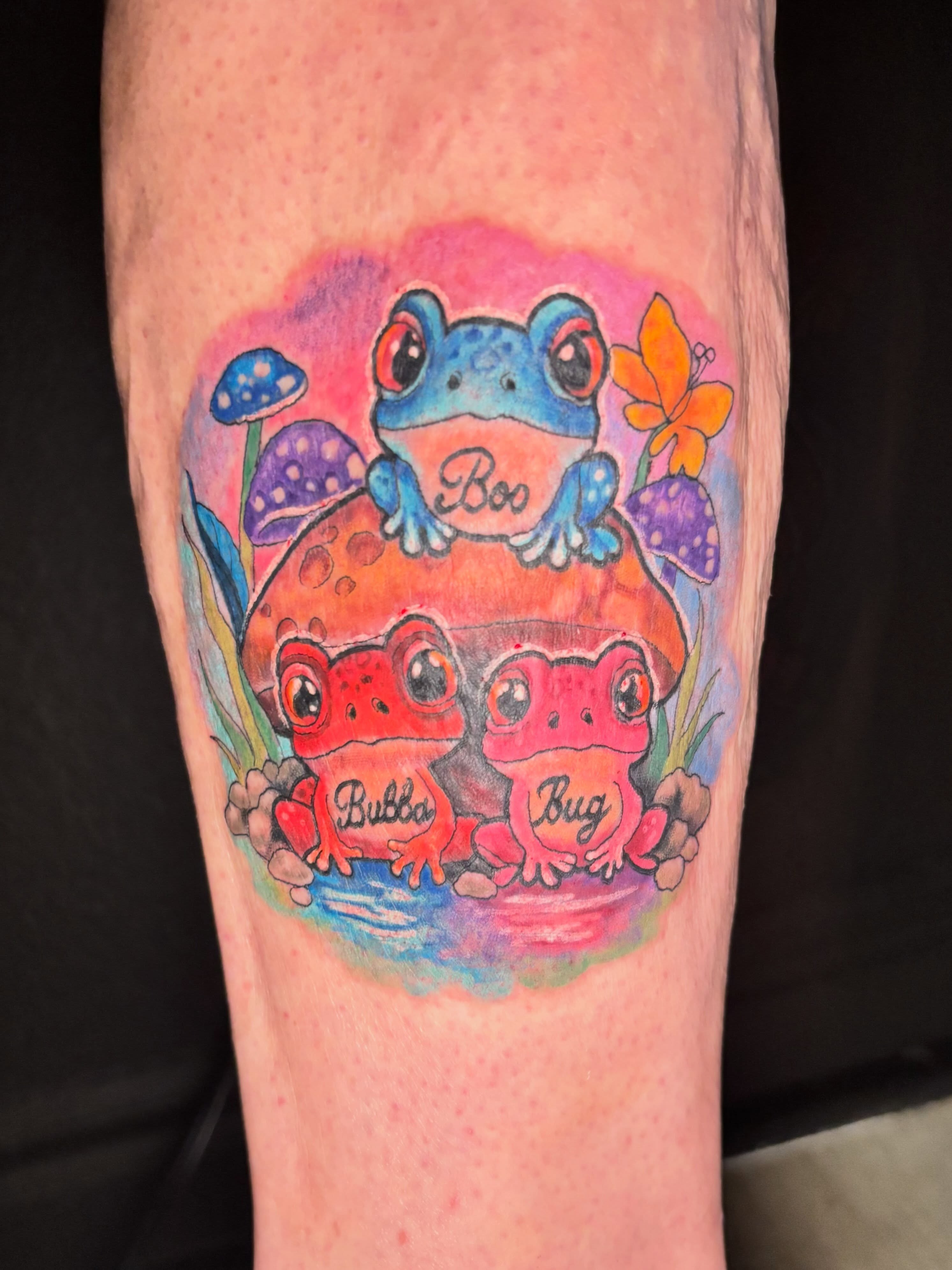 Frogs and mushrooms watercolor tattoo on the forearm by Taylor Tha Color Queen