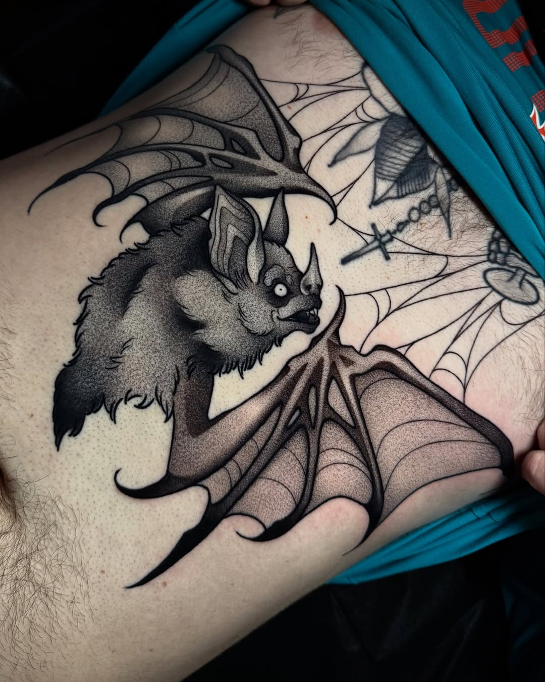 Bat black and grey tattoo on the ribs by Bell Bolton