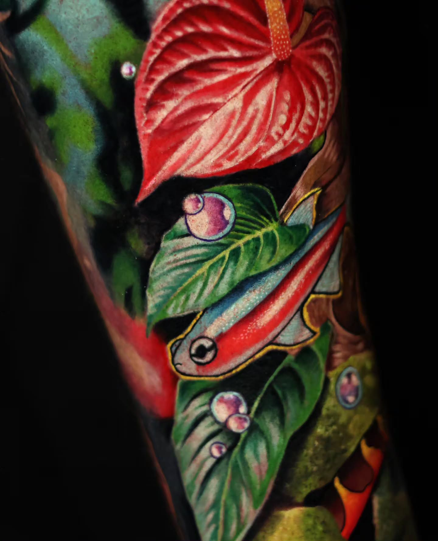 Fish and leaf American traditional tattoo on the forearm by Ciani Holman