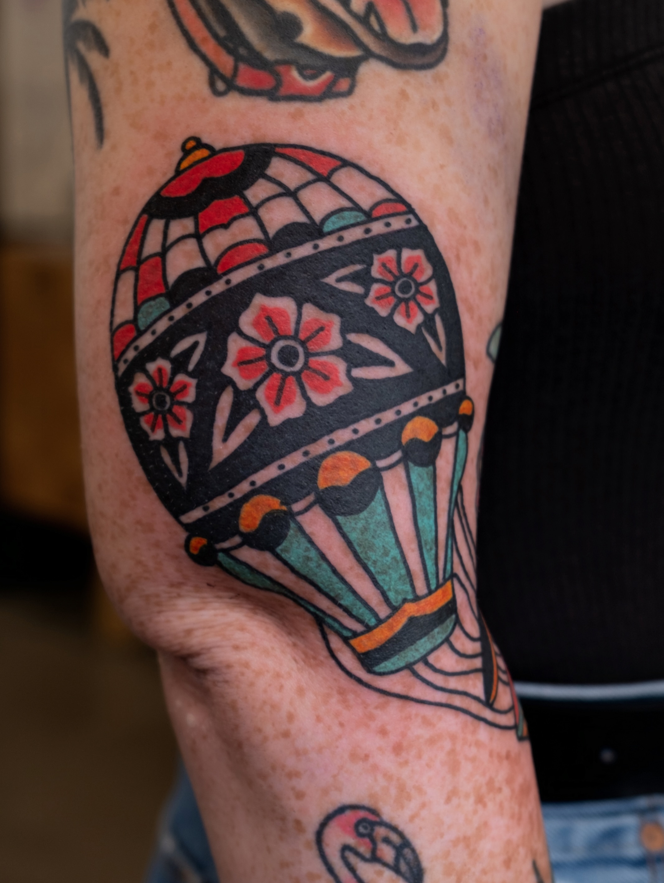 Hot air balloon American traditional tattoo on the forearm by Neto Velasco - Sad Cat Tattoo, Austin, Texas