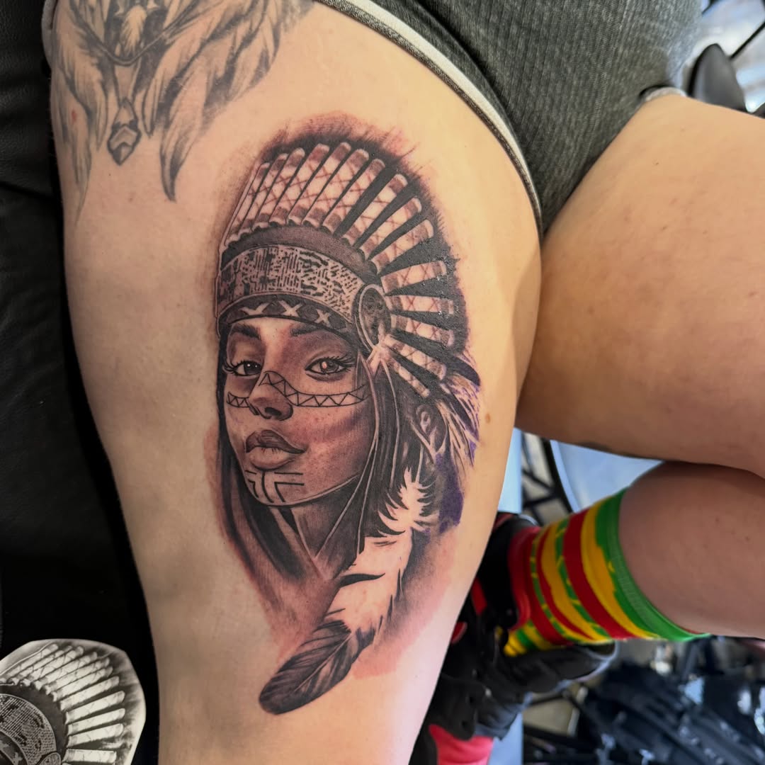 Indian headdress realism tattoo on the thigh by Trocon Talhouk