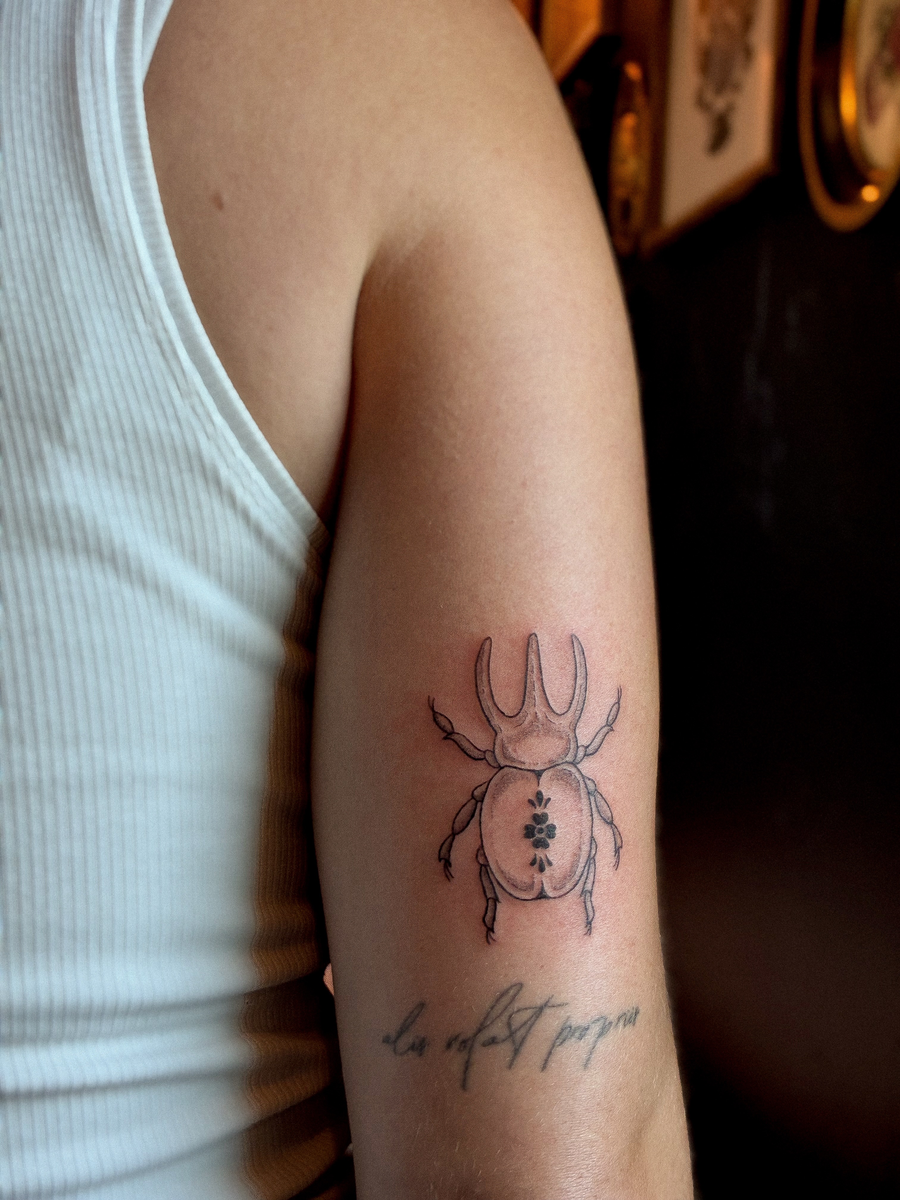 Scarab beetle geometric tattoo on the forearm by ⊹ Avery Peterson ⊹