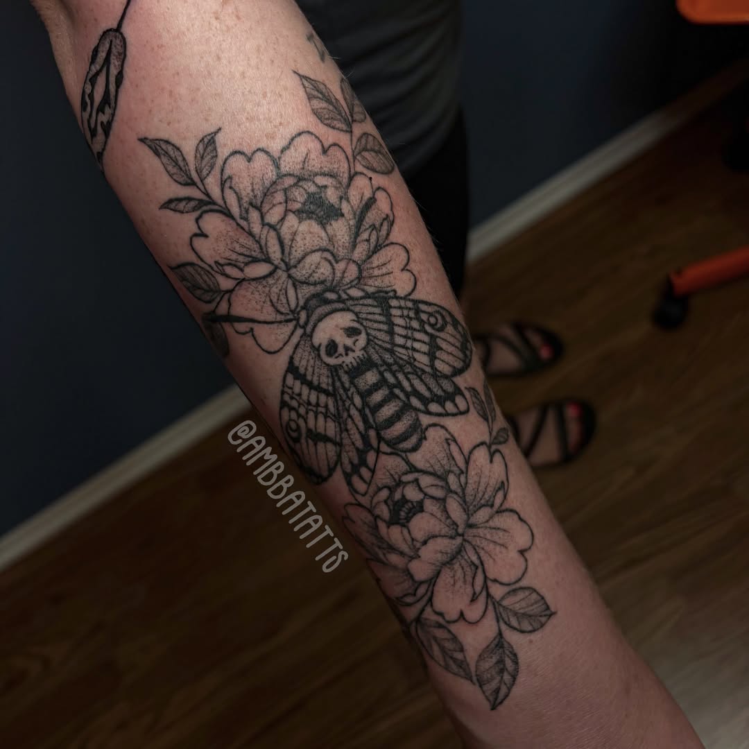 Moth and flowers dotwork tattoo on the forearm by amber brady, Brunswick, Ohio